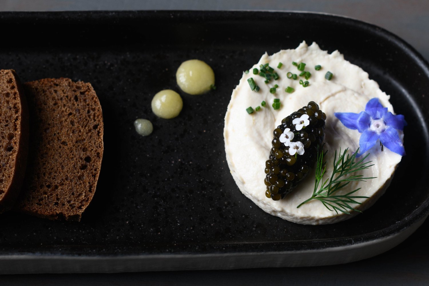 House-smoked sturgeon, Kaluga caviar, preserved Meyer lemon and petite rye