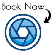 Icon of a camera shutter lens with a circular design, as a hyperlink to request more information about booking the photo bus