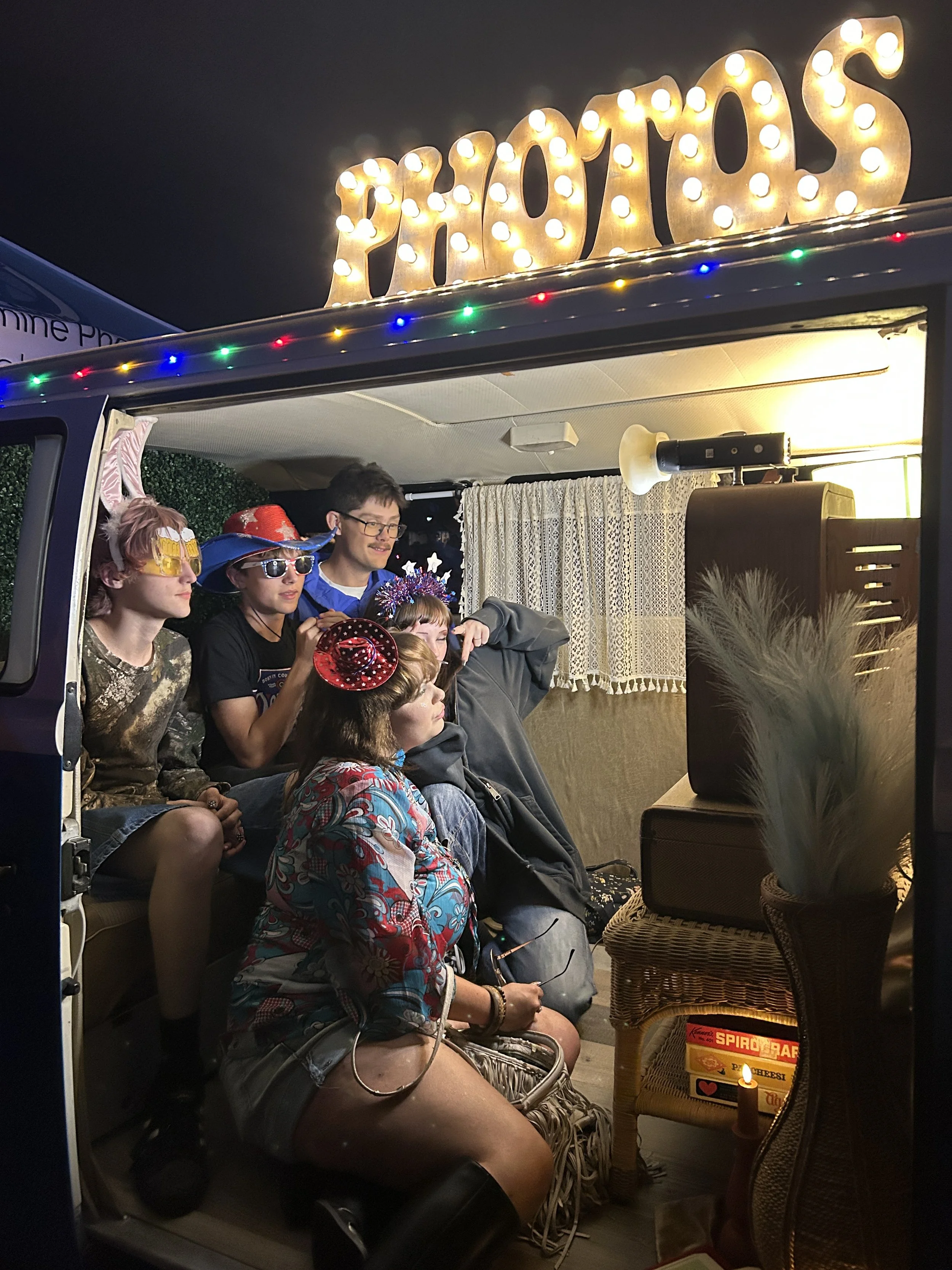 Night time shot of photo booth attendees