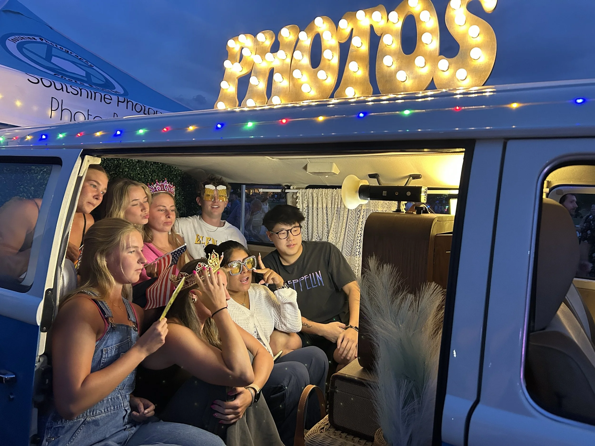 Night time shot of photo booth attendees