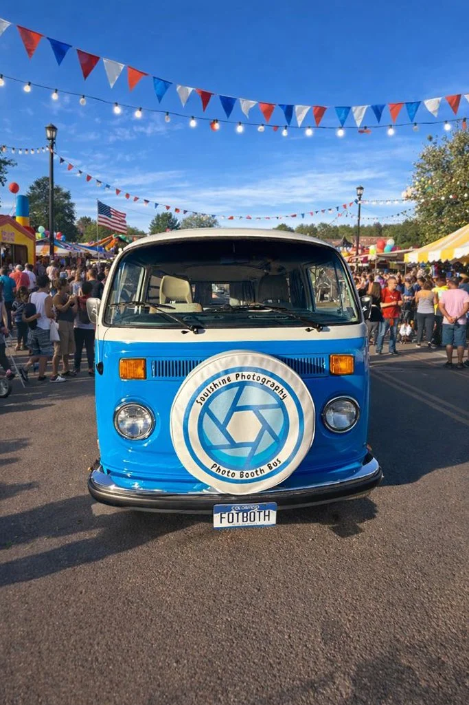 Blue, VW bus at a town festival