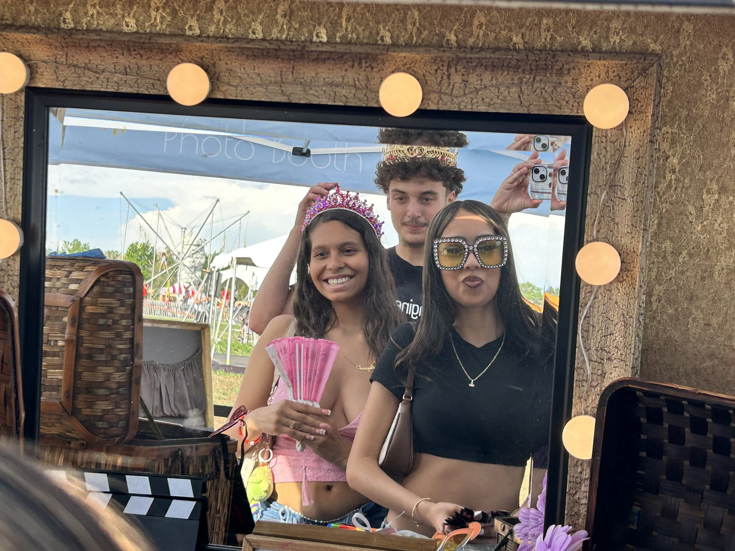 Photo booth attendees looking at props