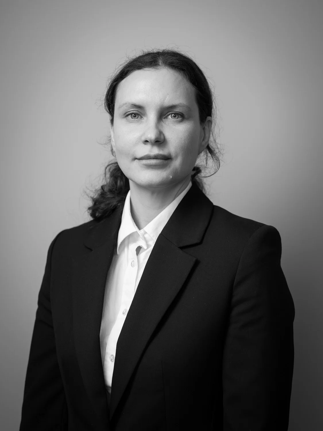 Business headshot photographer London, female professional, plain background, kings cross