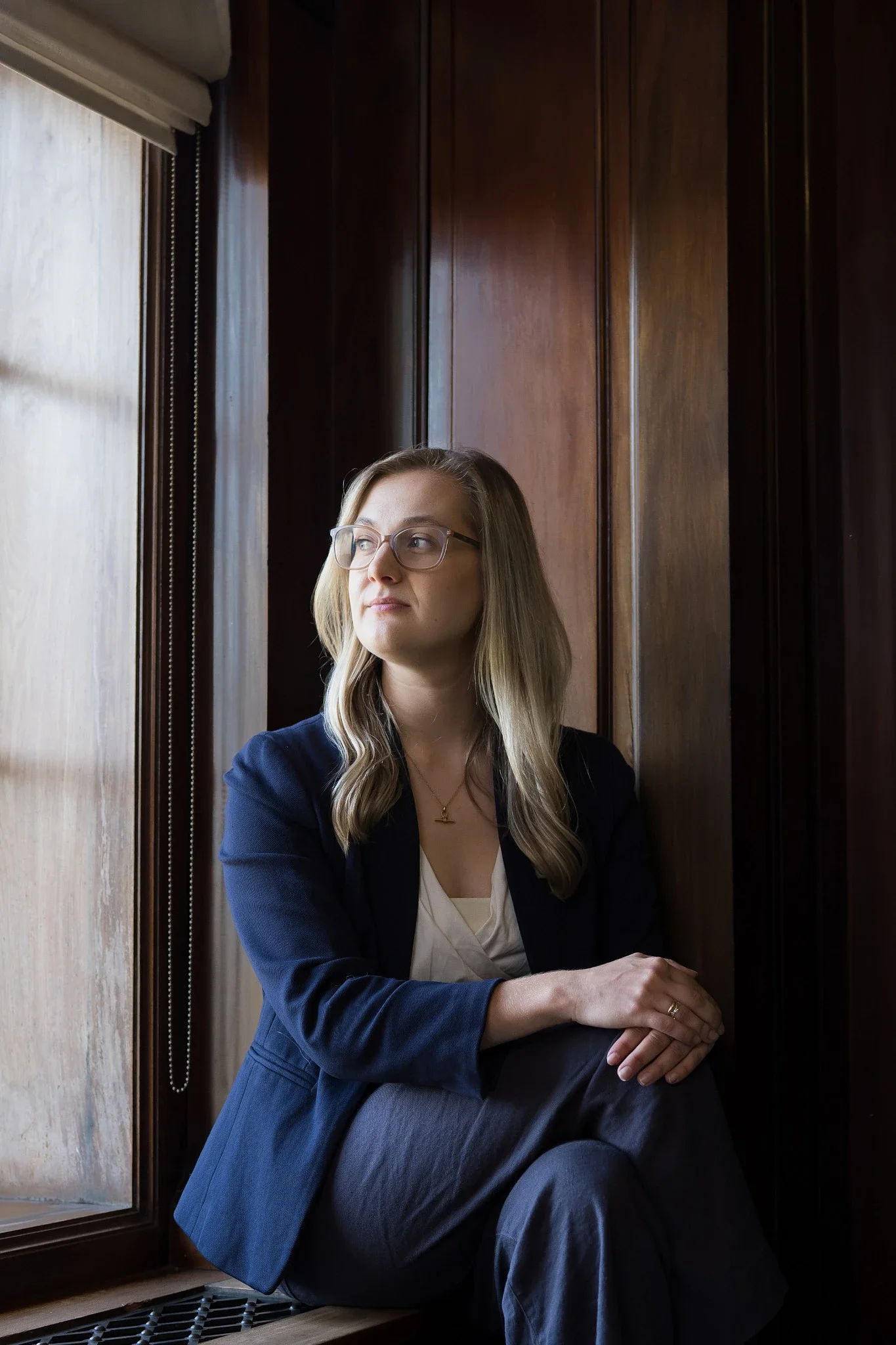 Female founder, old building background, suit, natural light, Fitzrovia
