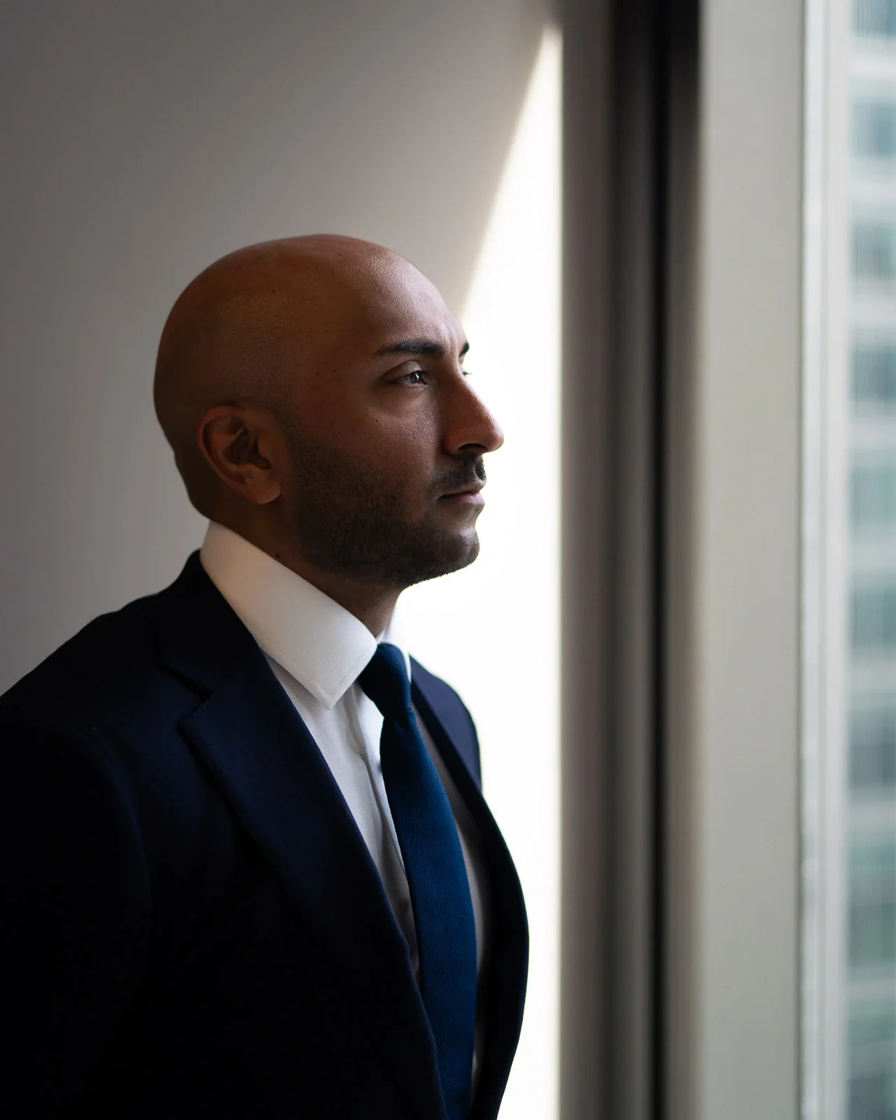 Male finance professional, city of london, office backdrop