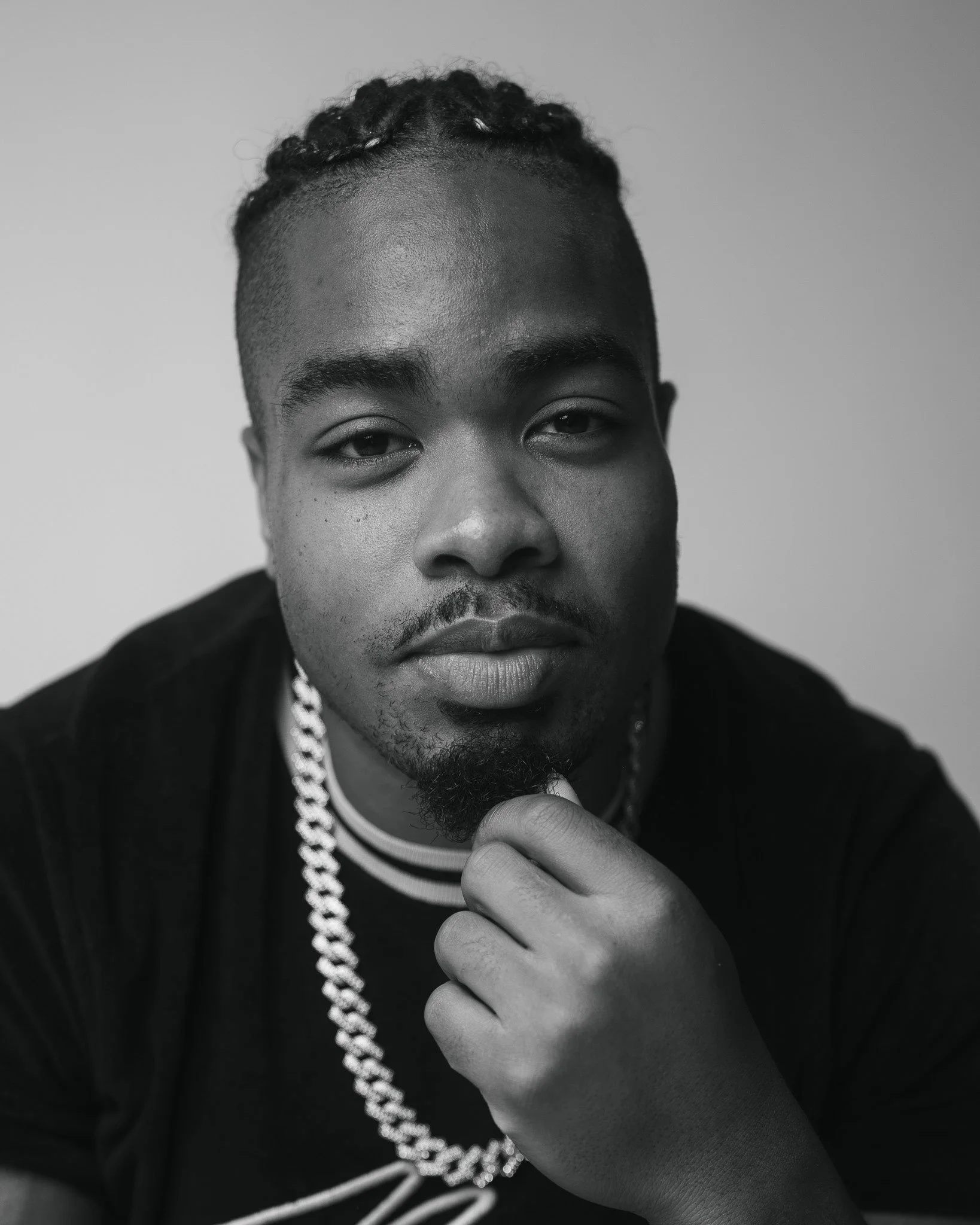 Candid headshot capturing confident expression and personality.