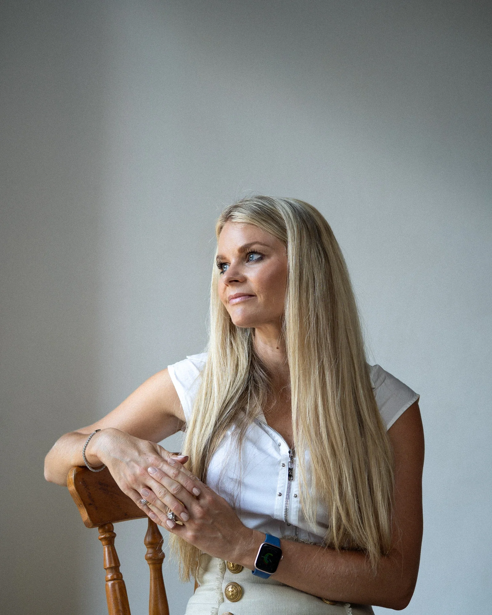 Female Executive, plain backdrop, natural lighting, city of london