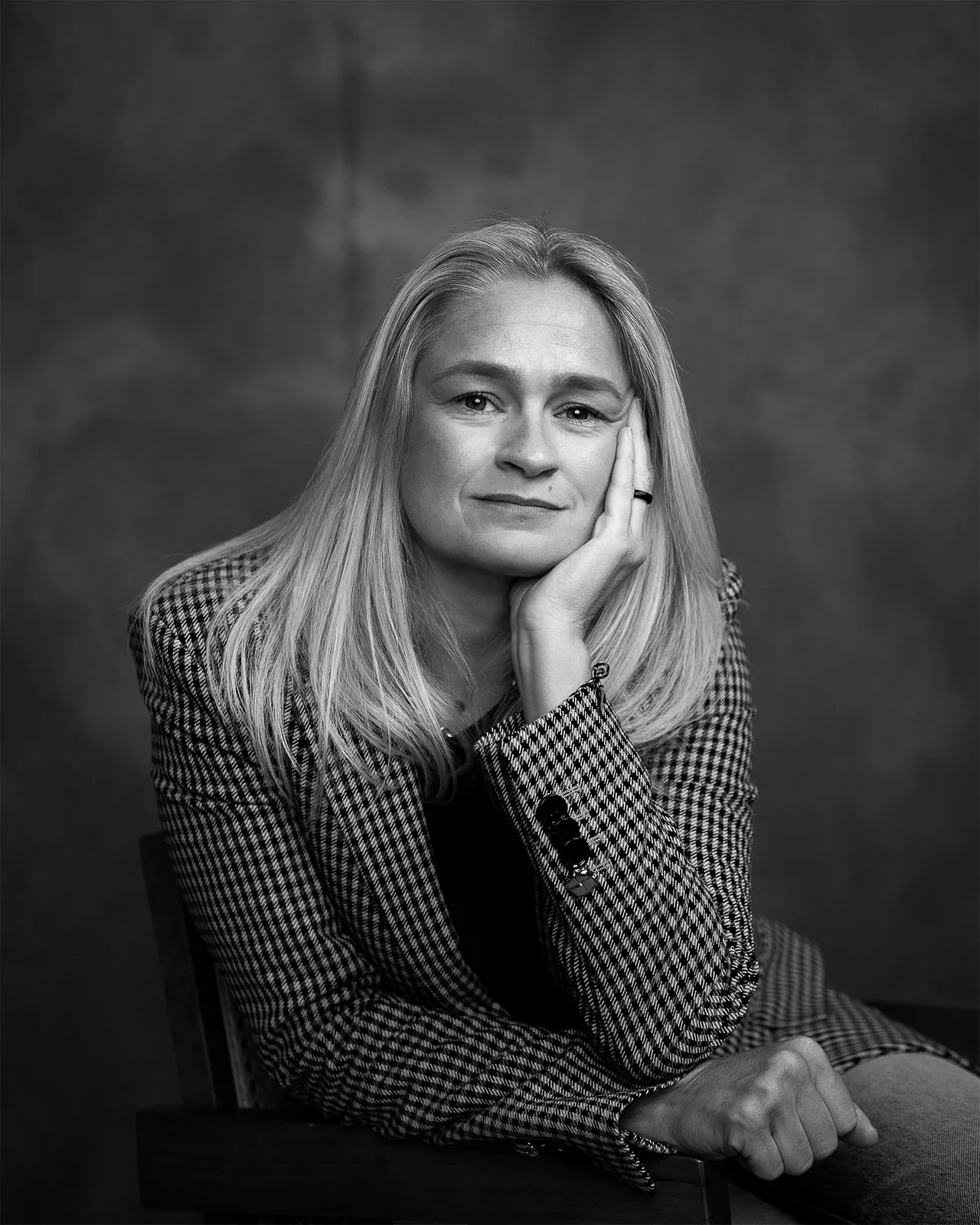 Corporate headshot in london of a woman with a studio background