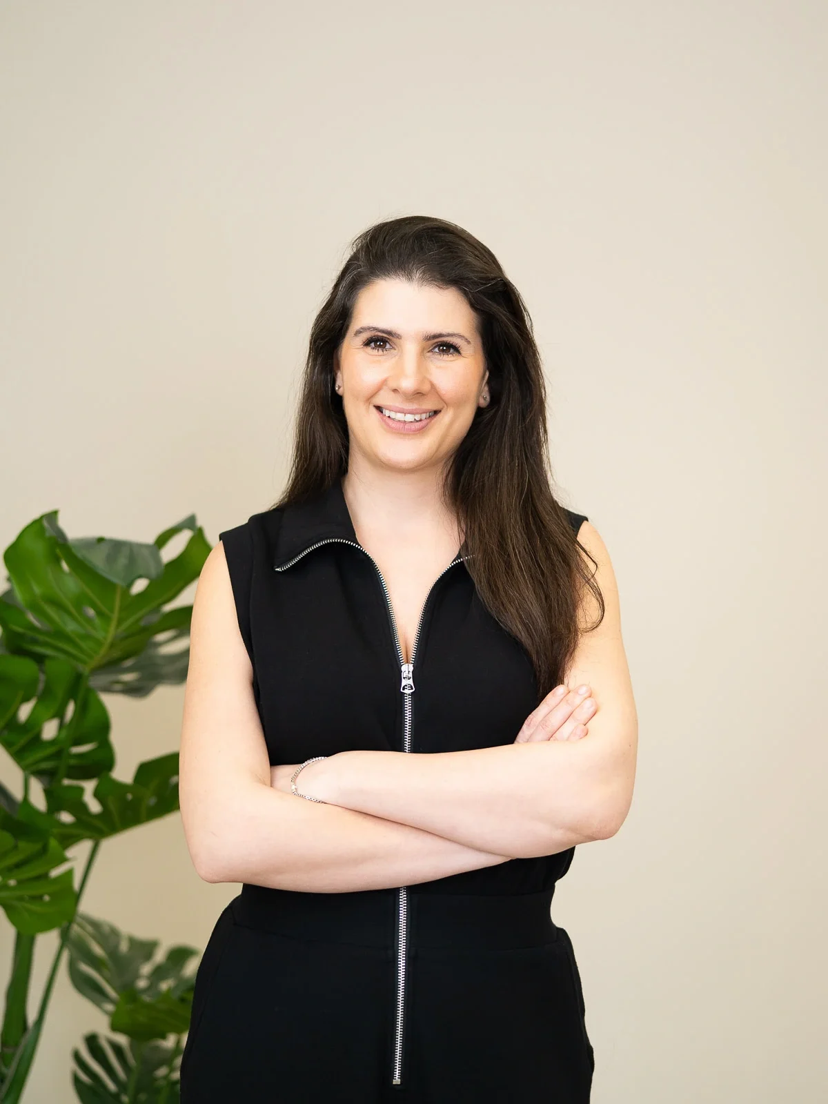 Corporate portrait of a woman on a plain background