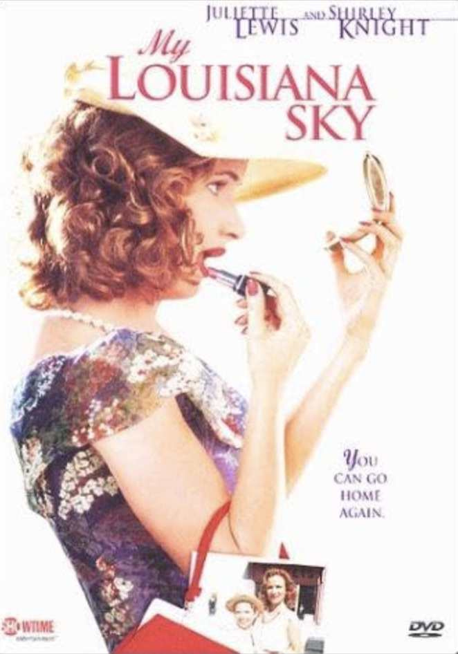 DVD cover for 'My Louisiana Sky' showing a woman with curly hair, wearing a floral dress, applying lipstick, holding a compact mirror, with text indicating the title and actors. There is a small photo of two children and a quote: 'You can go home aga