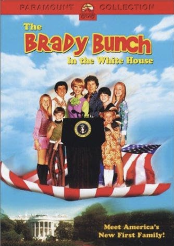A DVD cover for the TV show "The Brady Bunch in the White House" featuring the Brady family on a giant American flag-themed boat with the White House in the background.