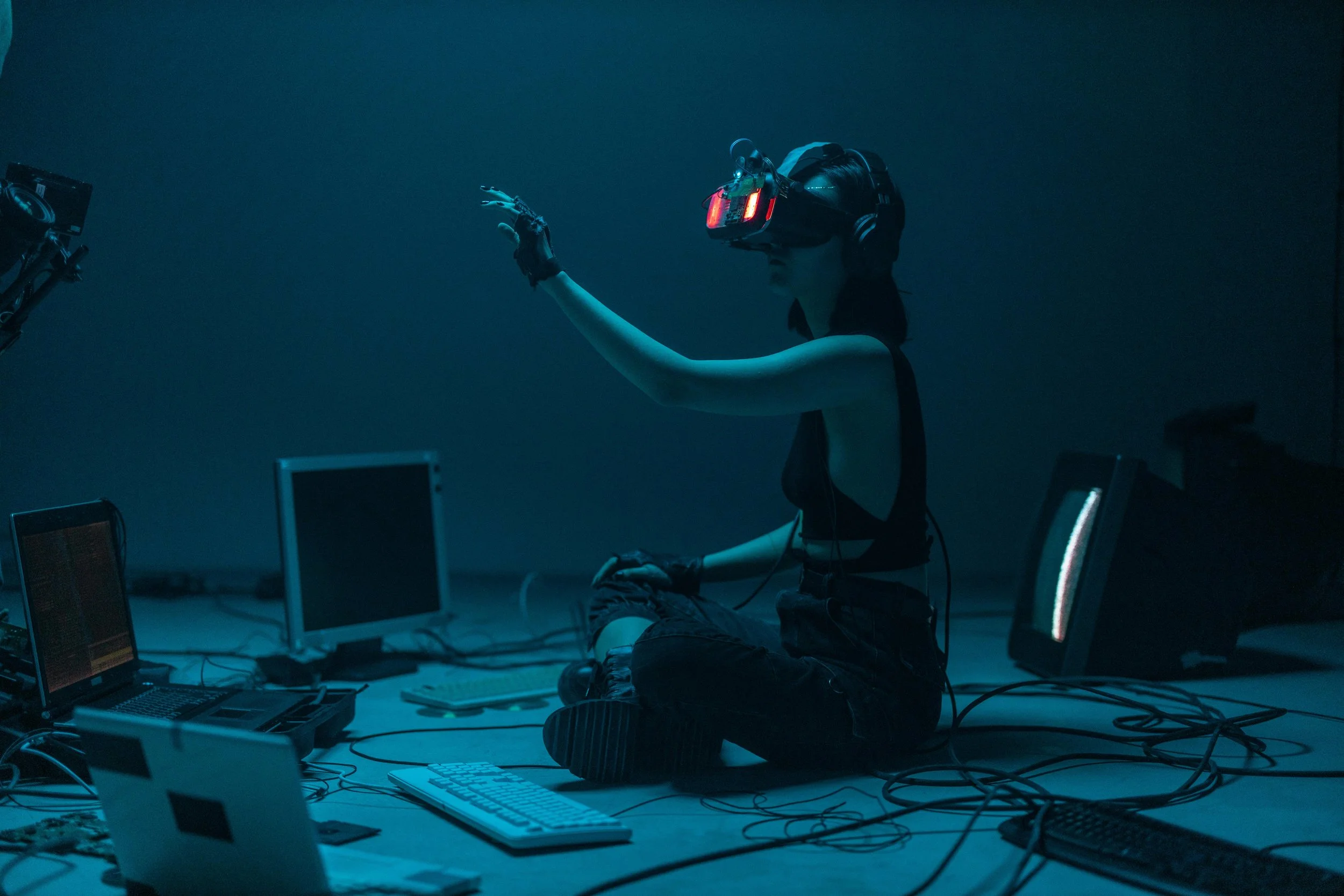 Person wearing a VR headset interacting with digital interfaces, symbolising human judgement in AI-mediated environments.
