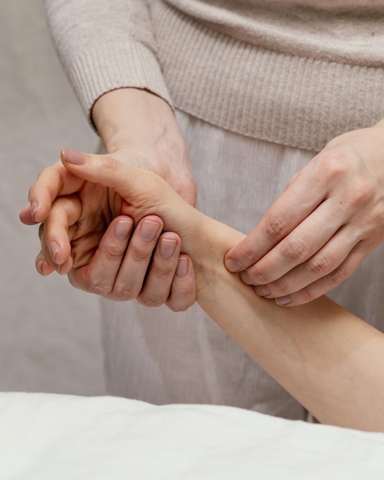 close-up-therapist-massaging-arm.jpg