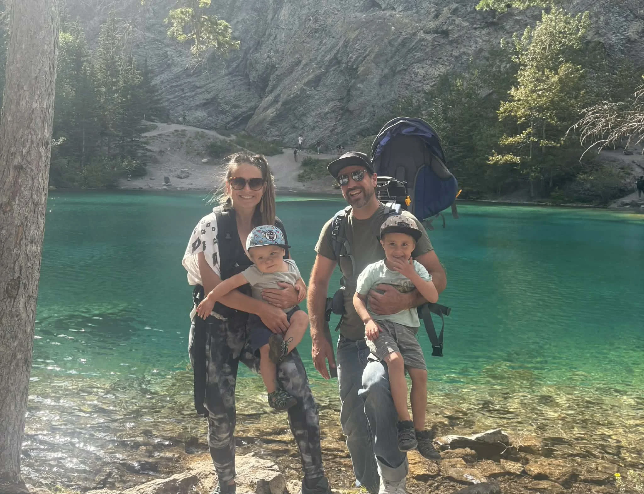 John and Paule Demers, owners of Final Coat Painting Inc., with their two sons at a mountain lake in the Bow Valley, Alberta
