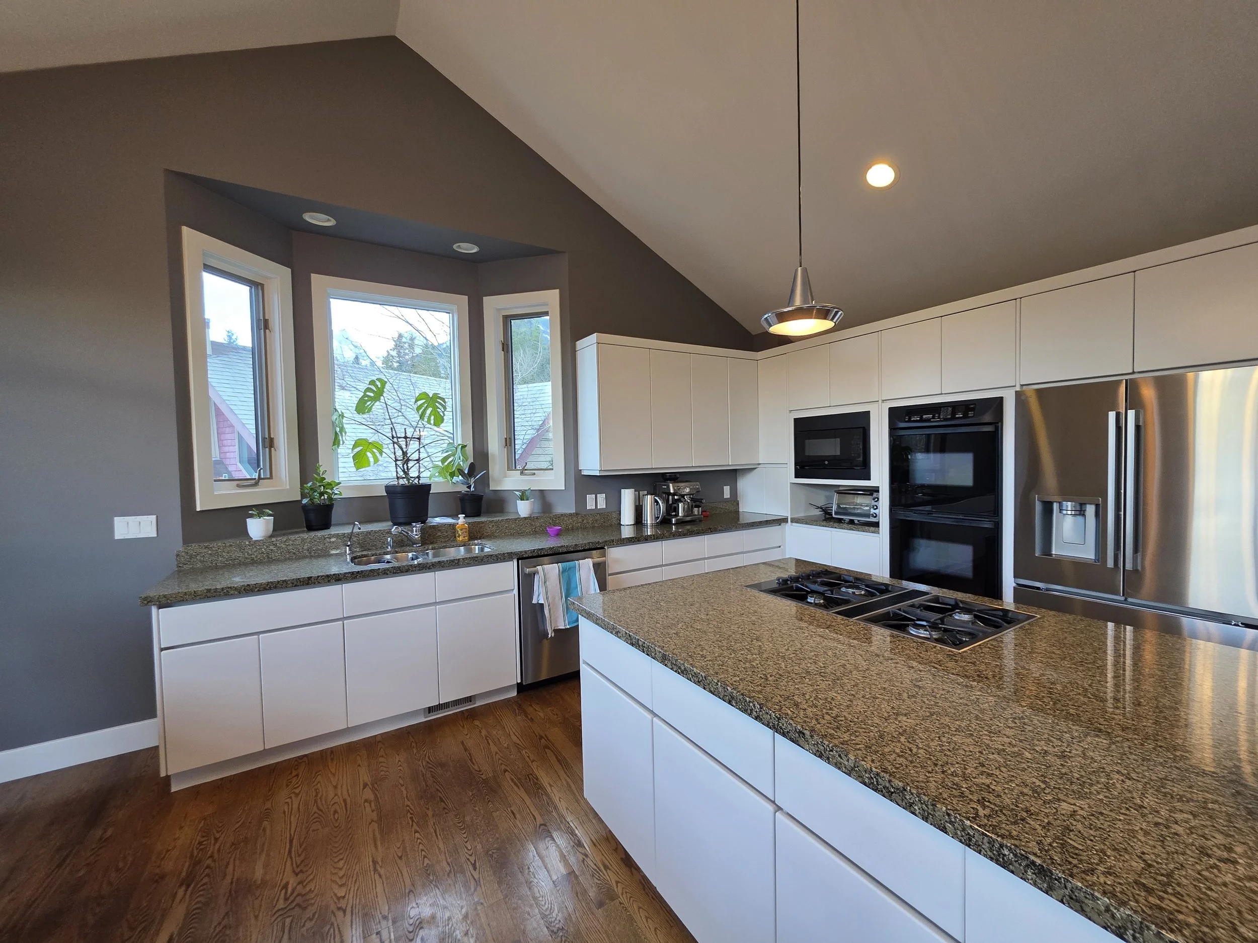 Interior painting and cabinet refinishing project in Canmore Alberta