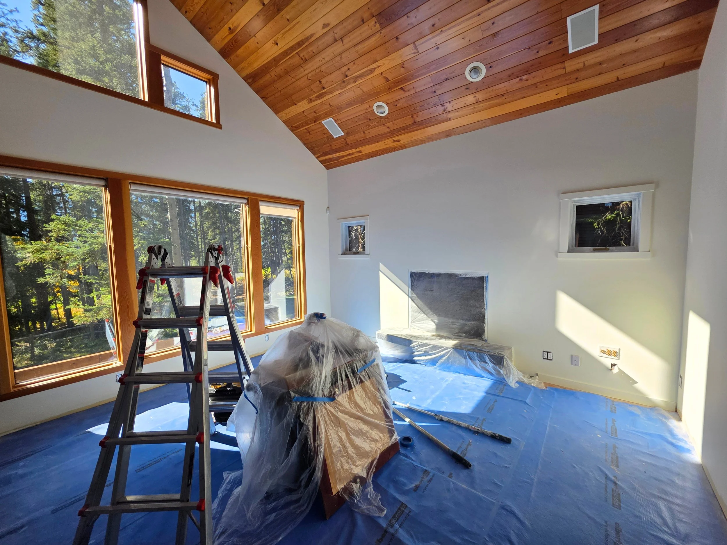 Interior painting of walls, ceilings and trim plus woodworking stain in a luxury home in Silvertip, Canmore