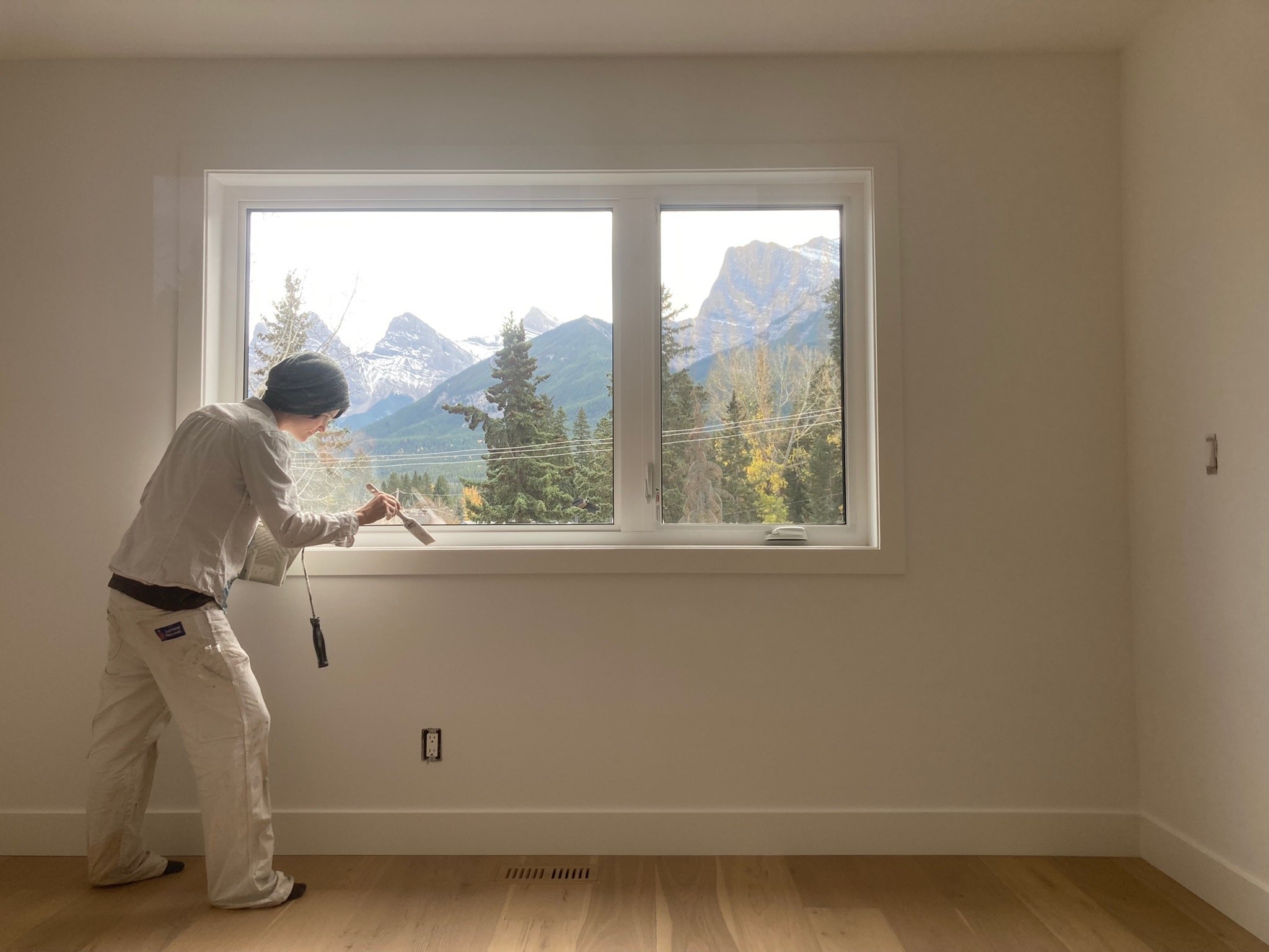 Skilled painters completing a high-end Canmore painting project in a luxury condo.