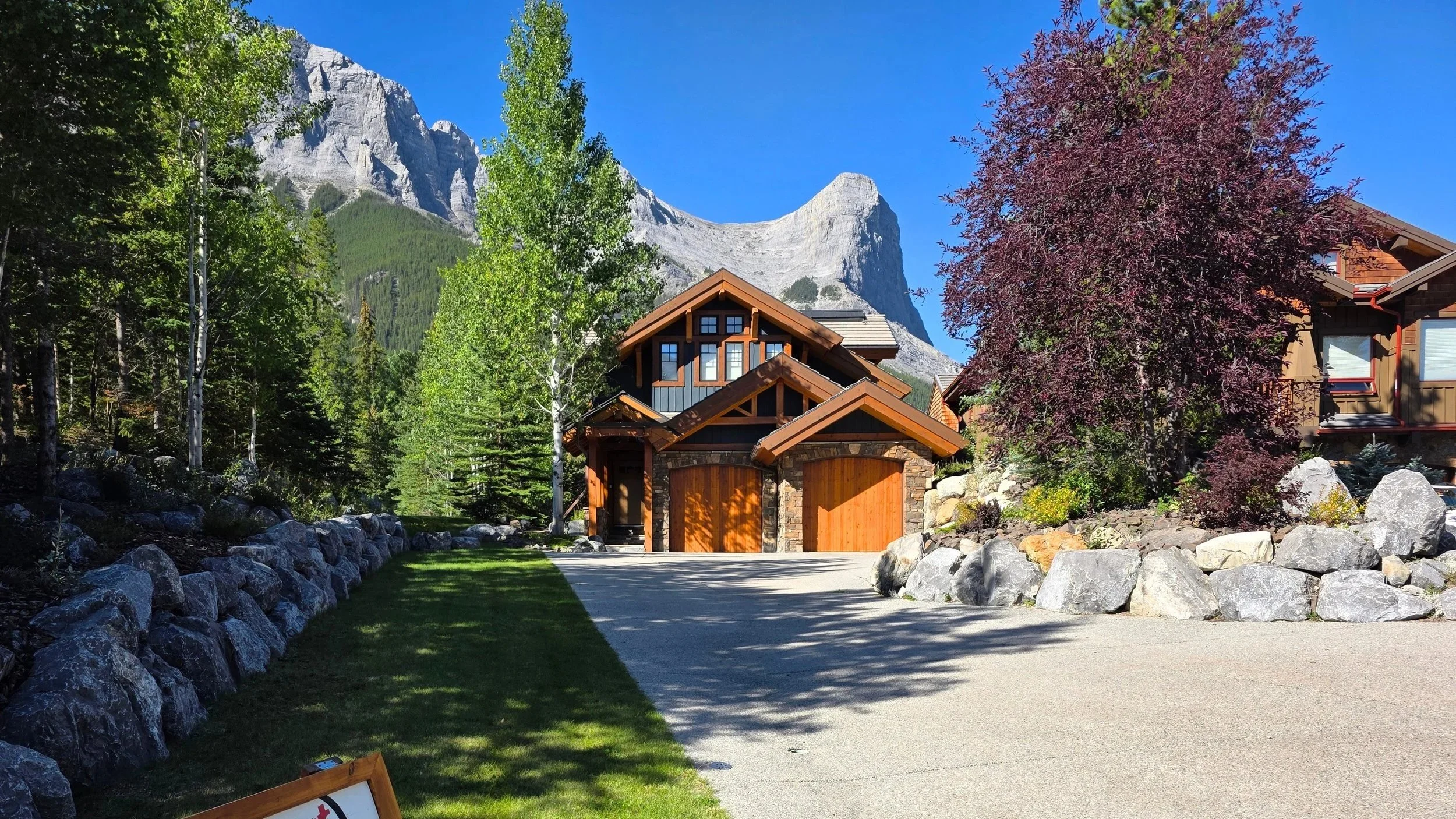 Canmore painters exterior painting project with mountain backdrop