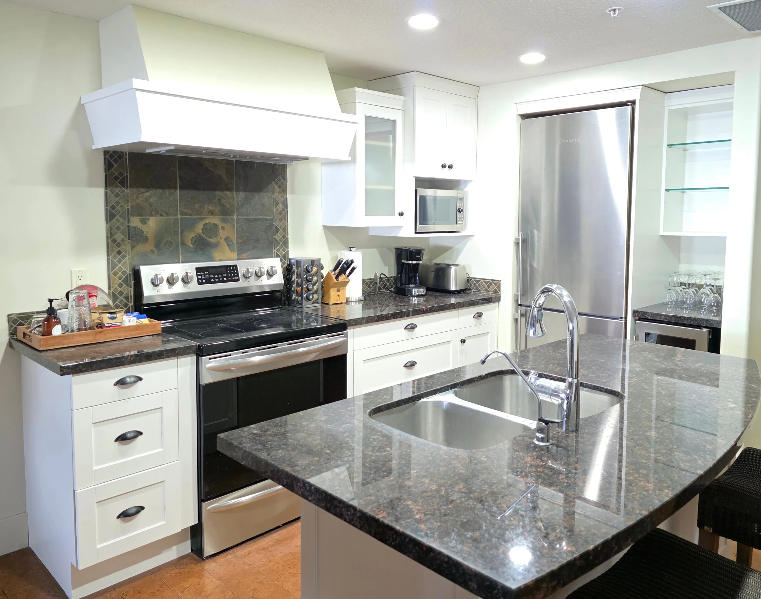 Kitchen cabinet refinishing in Canmore and Banff with a smooth professional spray finish