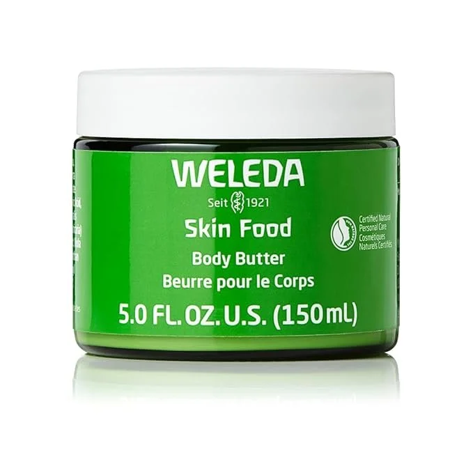 A green container of Weleda Skin Food Body Butter with a white lid.