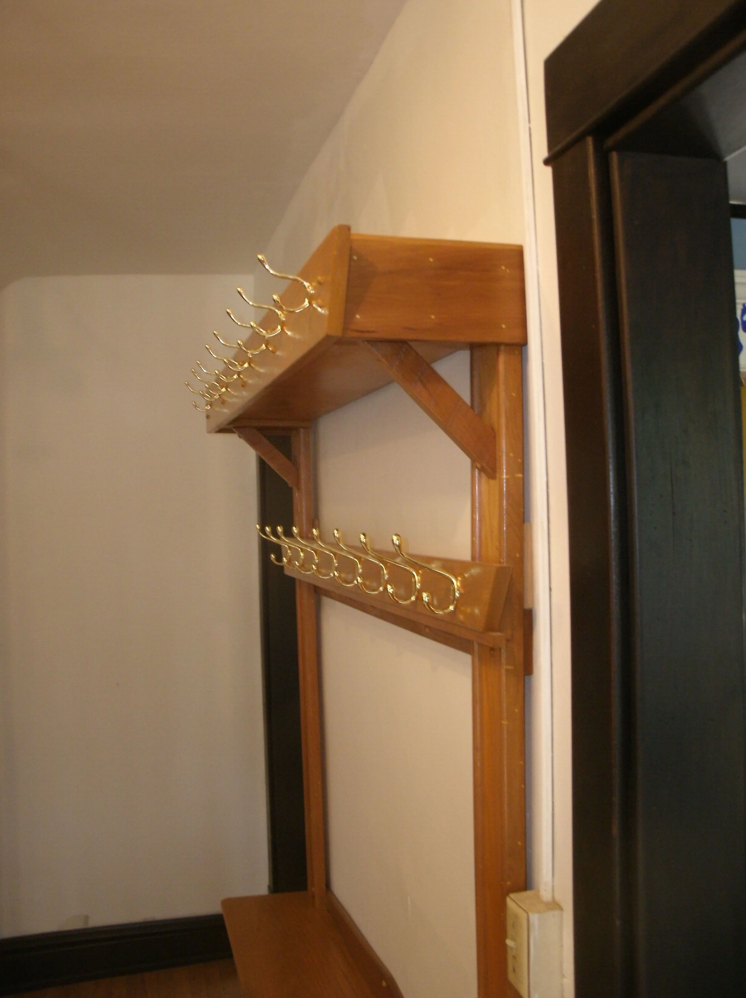 Second view of the entry hall, coat, and incidentals storage unit