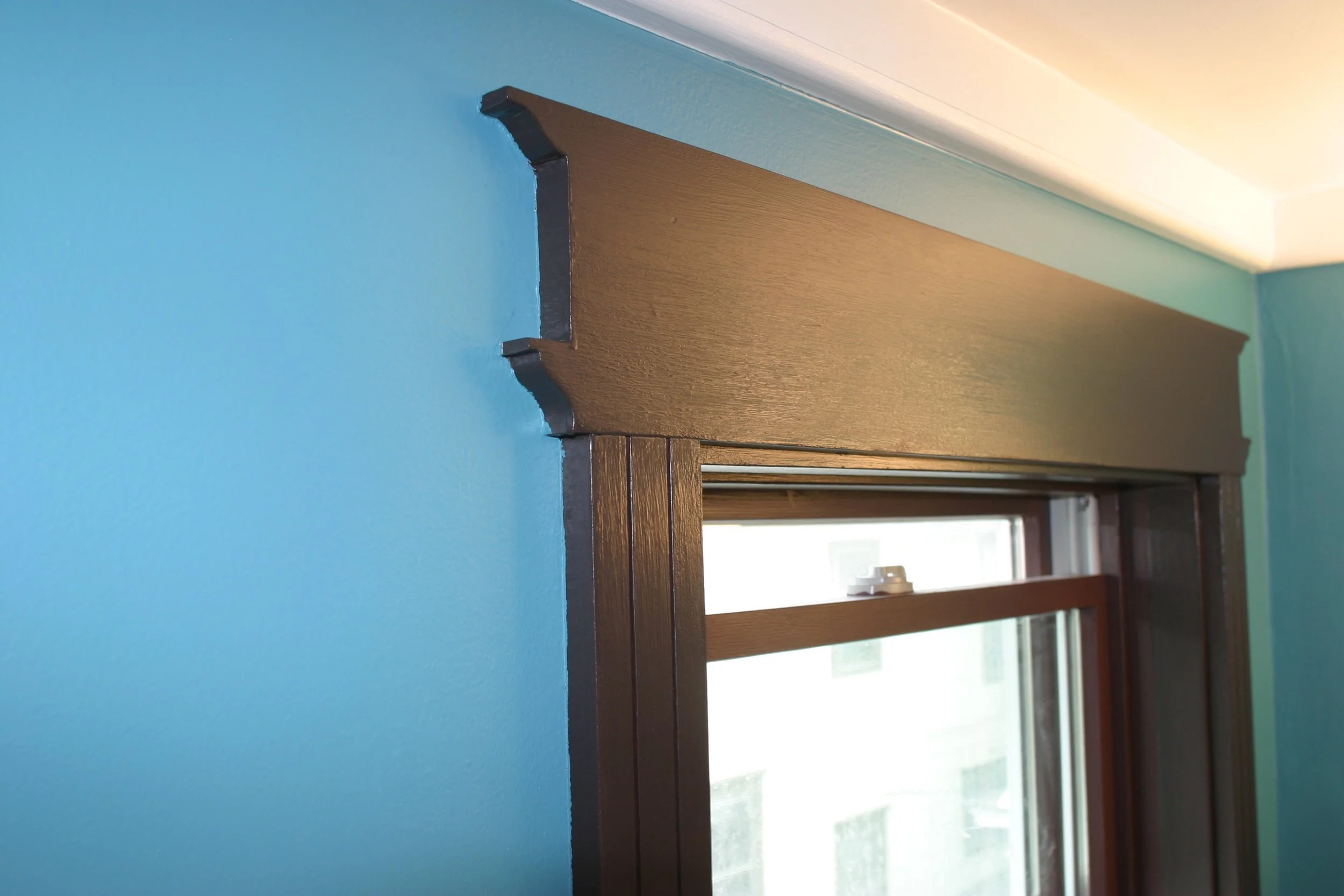 A detail of the Victorian-Ish top window trim.