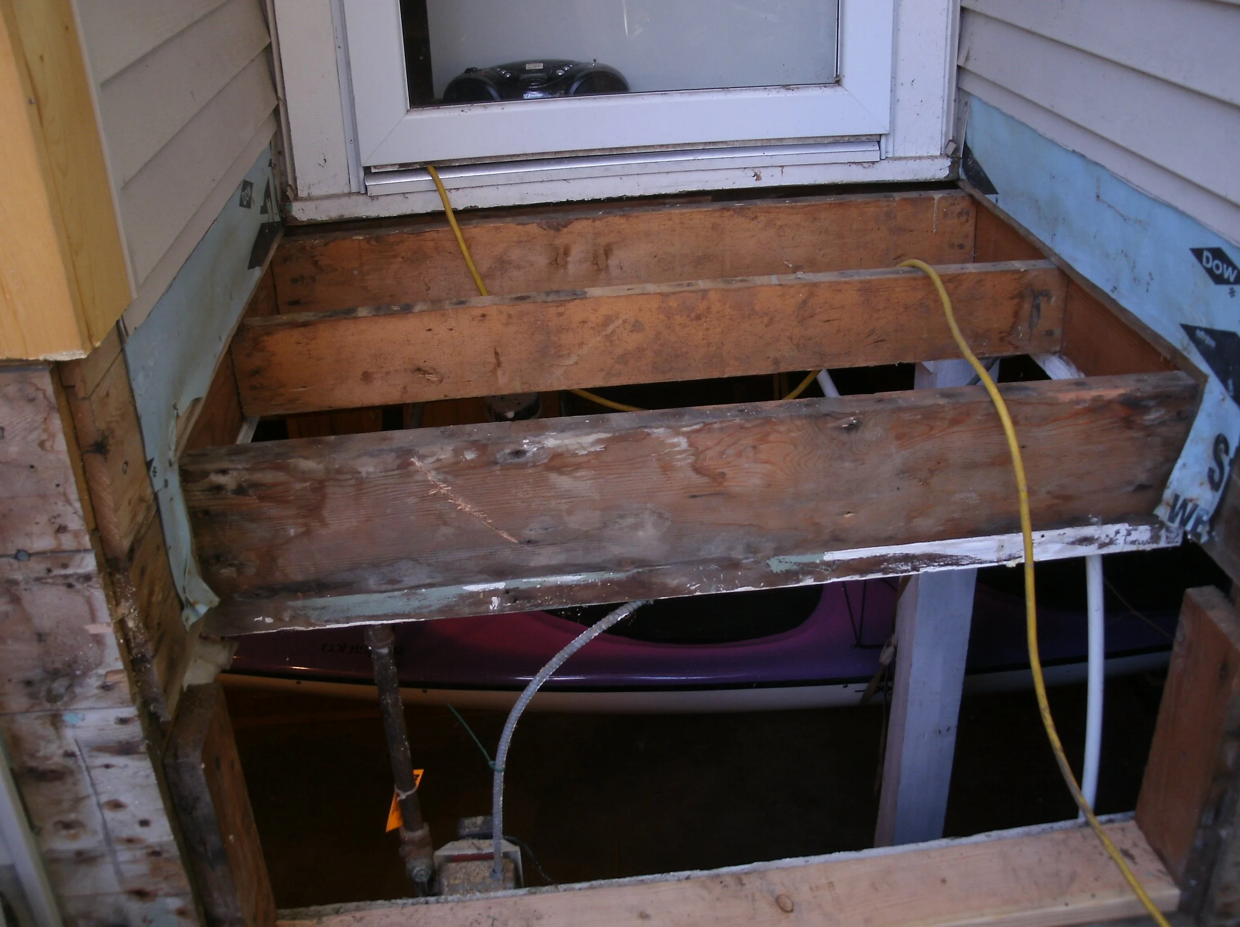 The original framing and lack of foundation exposed