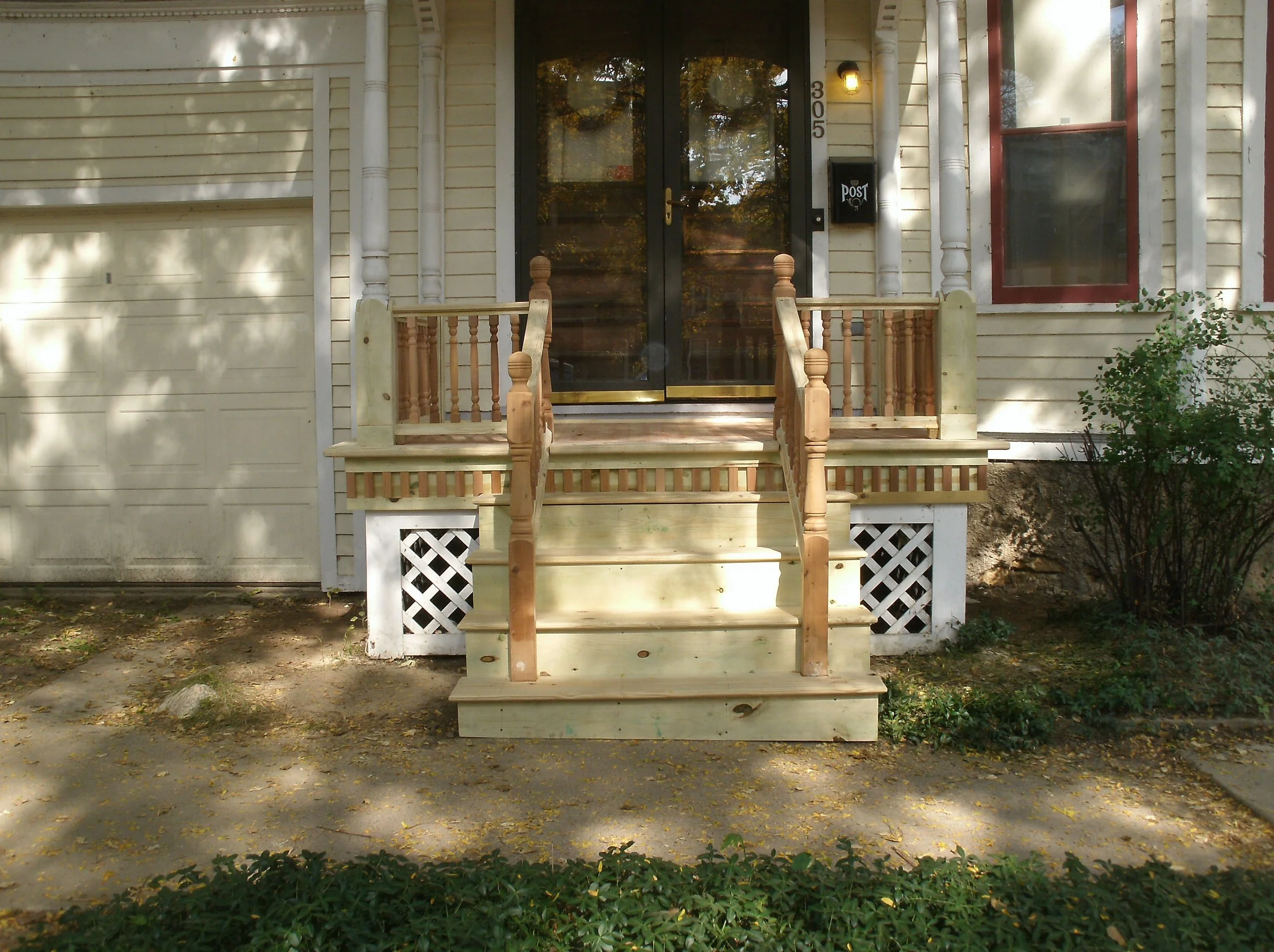New front porch. All unpainted wood was later painted.