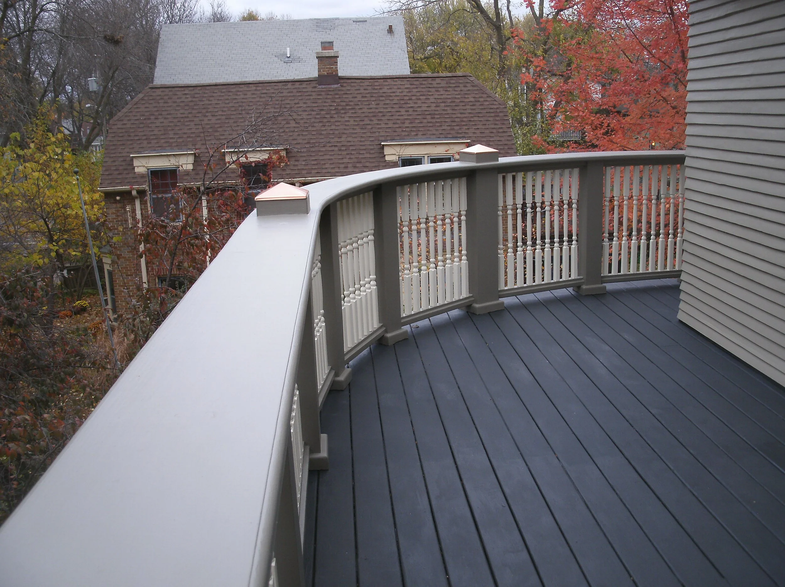 View of the West end of the railings and deck install installed and painted.