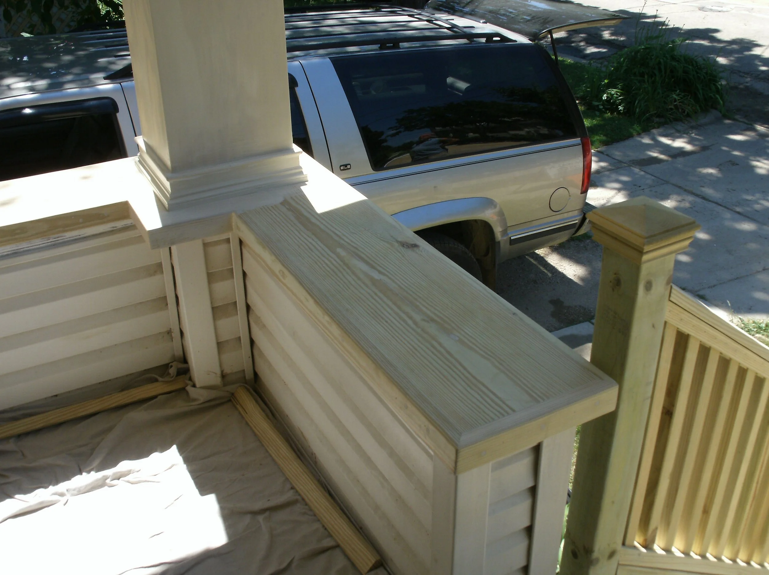 View of new porch, knee wall cap and bottom of new massive support post.