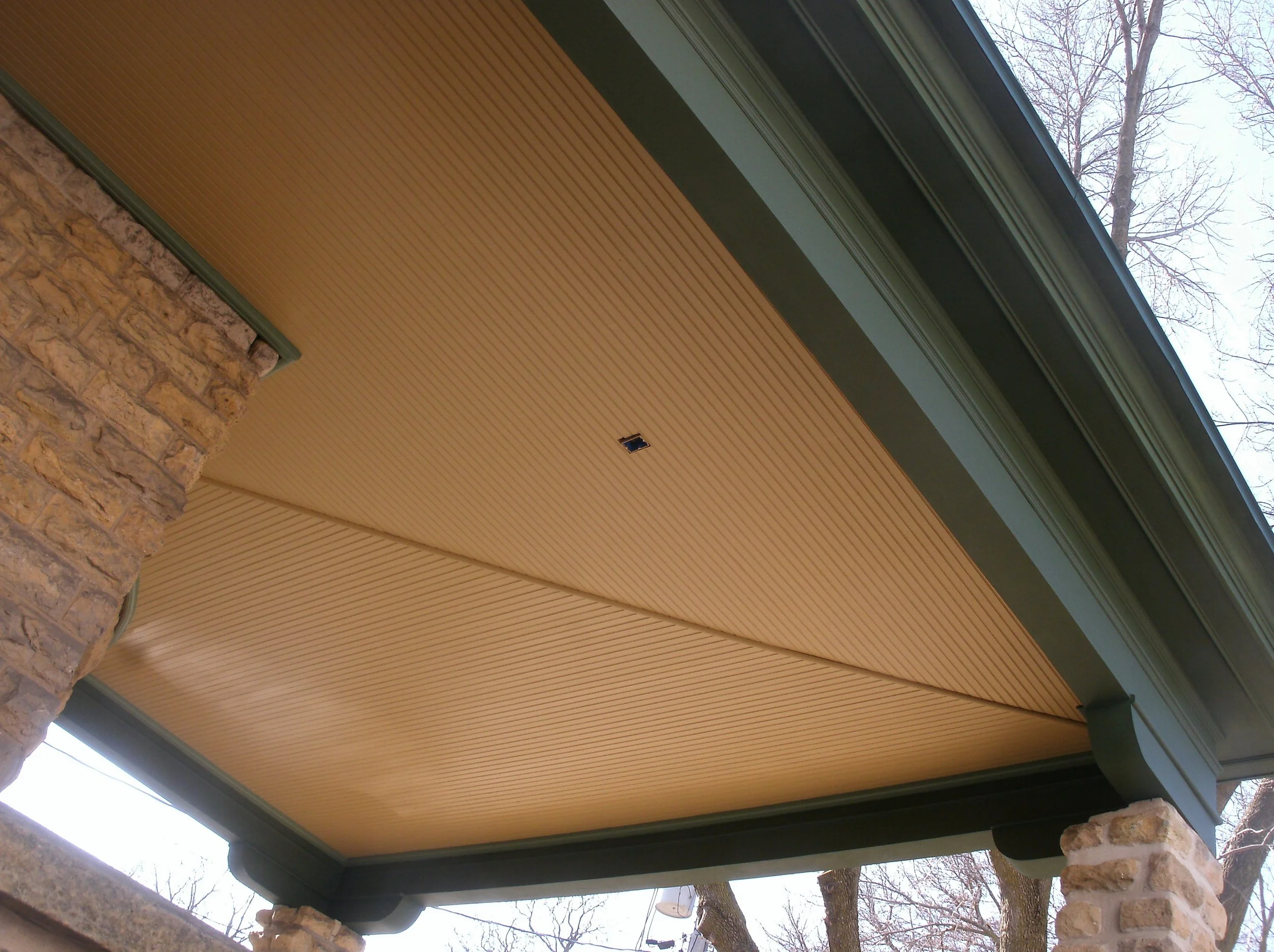 Porch ceiling composed of beaded ceiling tongue and groove individual pieces.