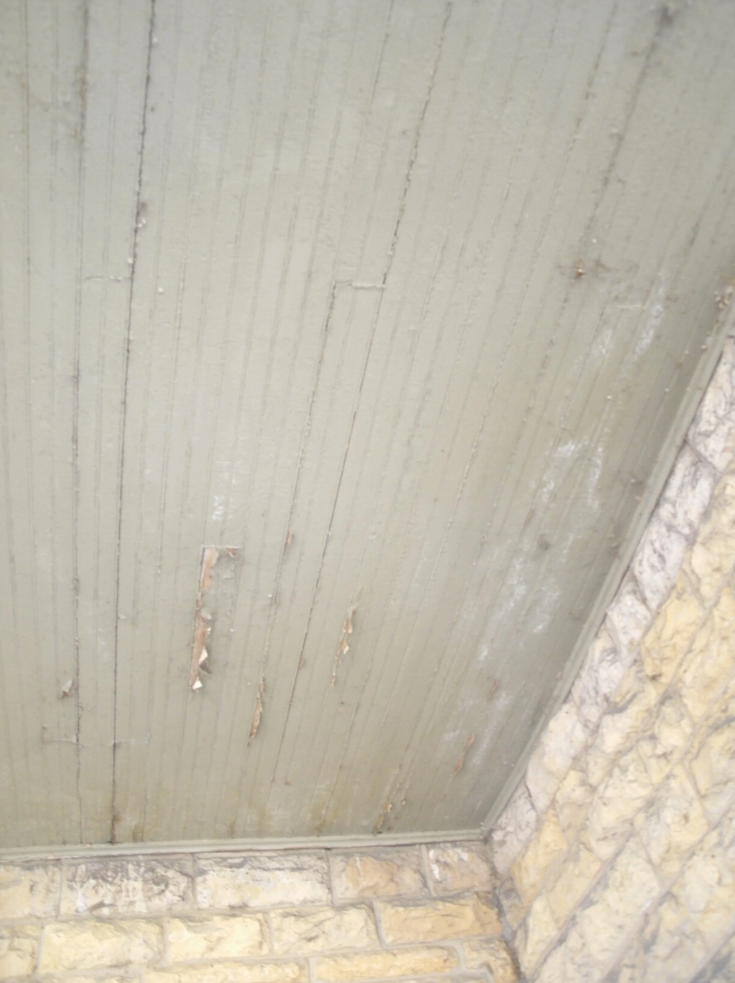 Water damaged beaded porch ceiling.