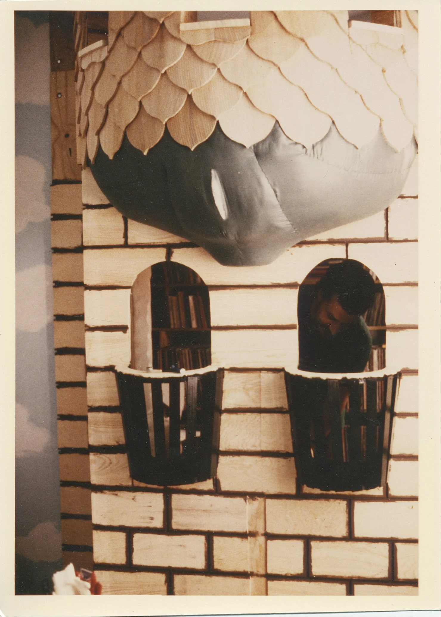 Plywood on, “stone look-wood,” shingles on, and tower base begun