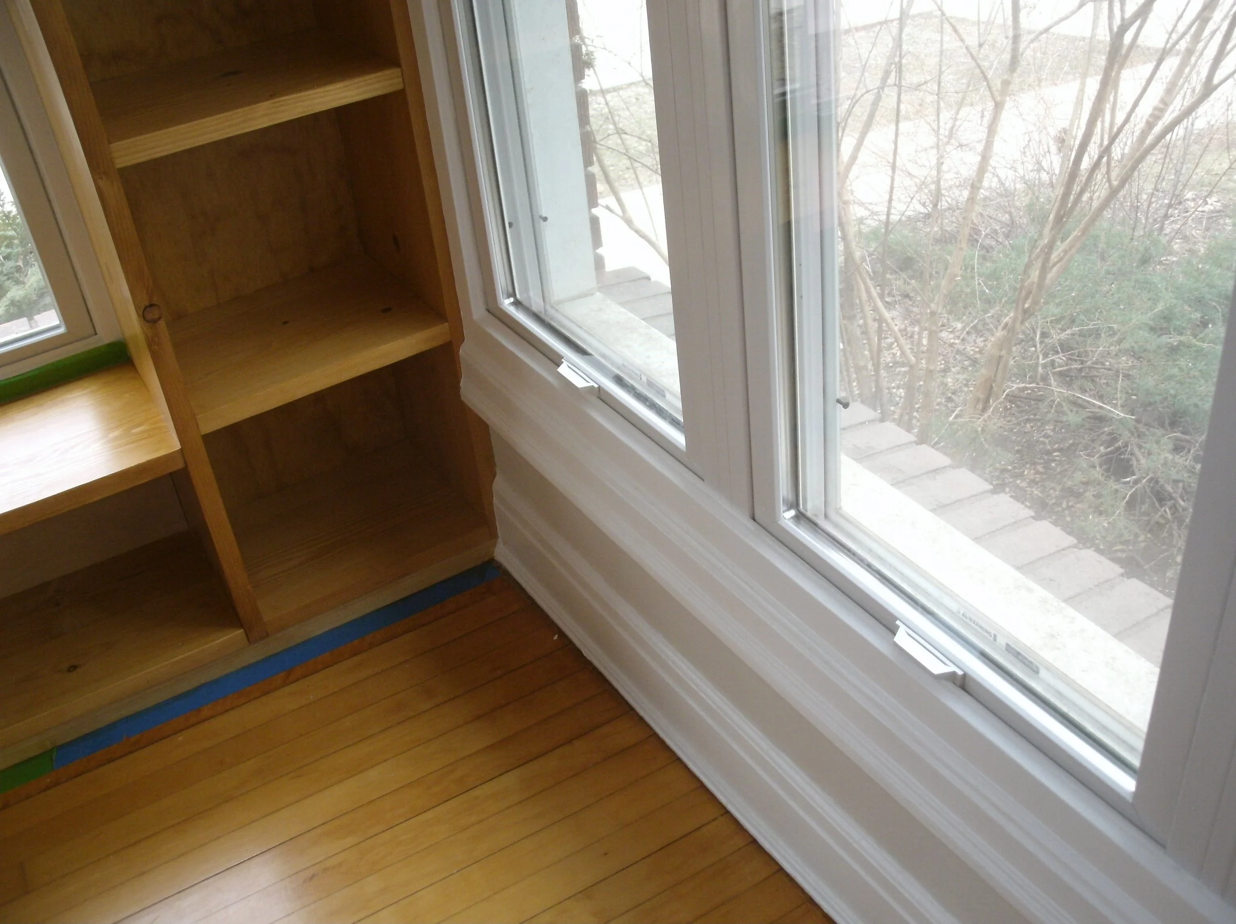View of the bottom window trim, and how it intersected with the new shelves