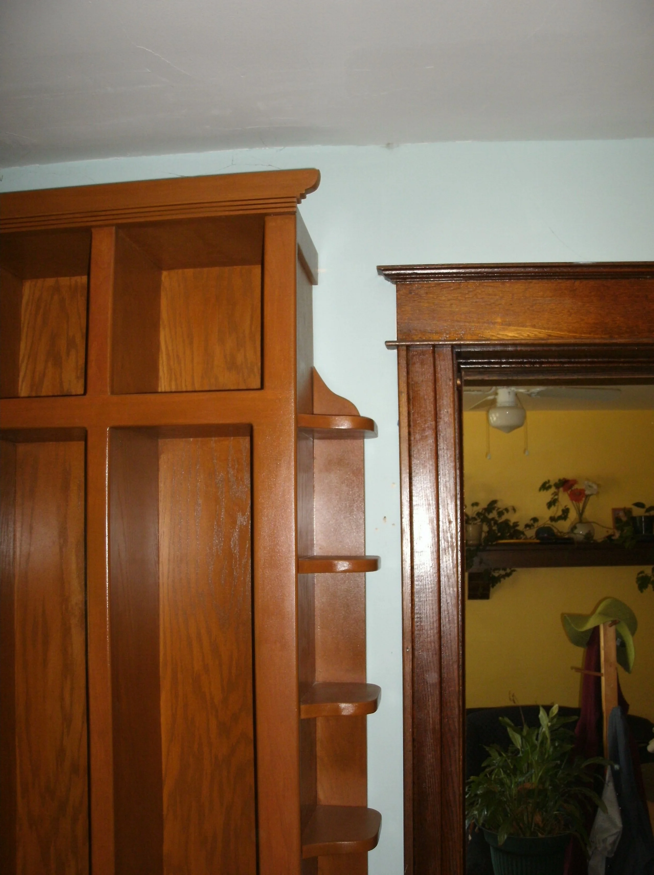 Note: side shelves. I like the top trim echoing original house trim.