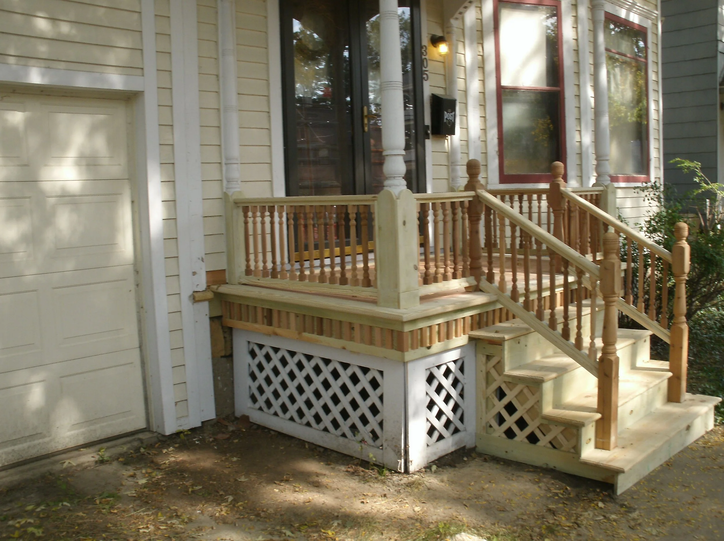 On the front porch, all new treated and cedar wood was not yet painted.