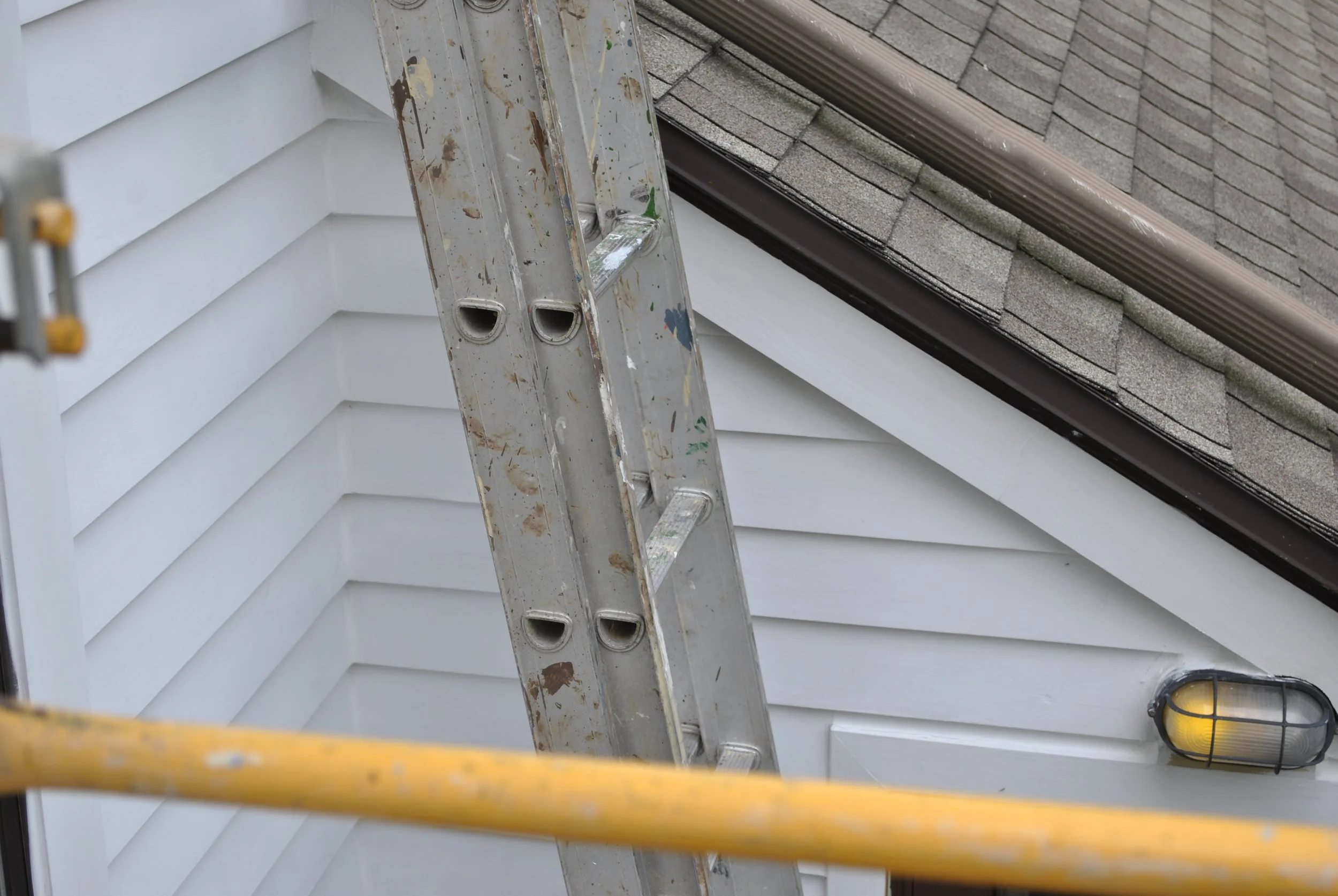 The new siding, drip edge, facia, etc. intersection with garage wall.