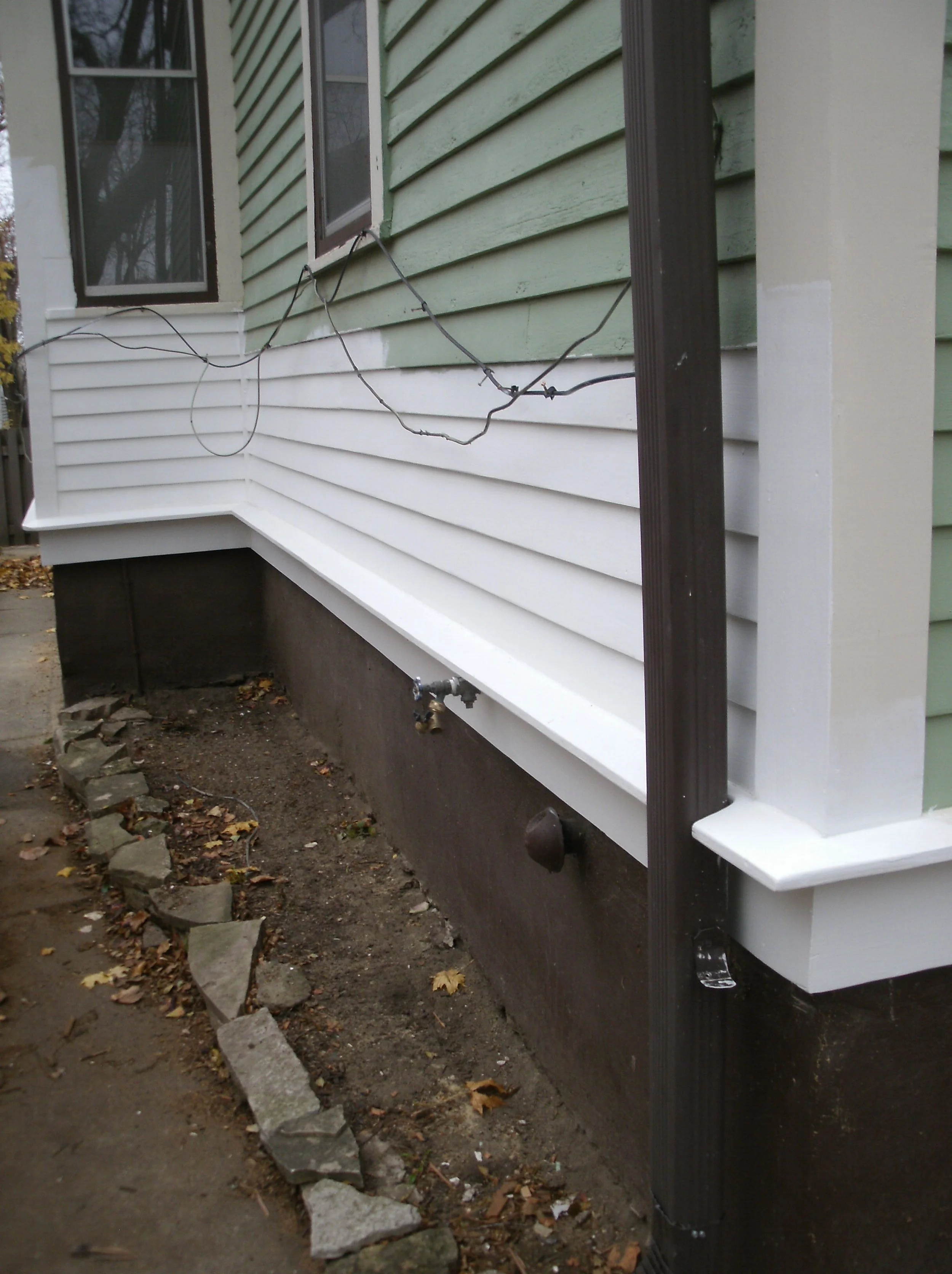 All primed wood (white) is new: sheathing, siding, drip edge, lower fascia.