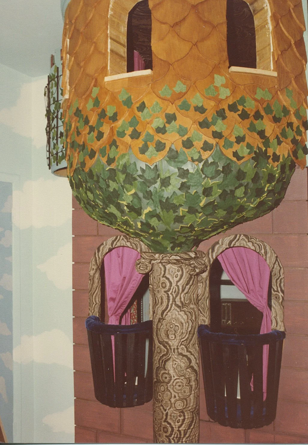 Close up of the ivy, the column and the stone rounded window trim