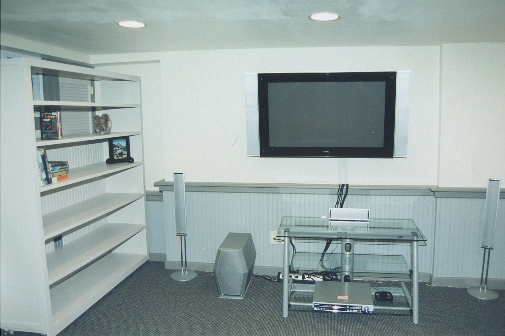 View  of the walls, wainscot, trim, moveable bookcase 	