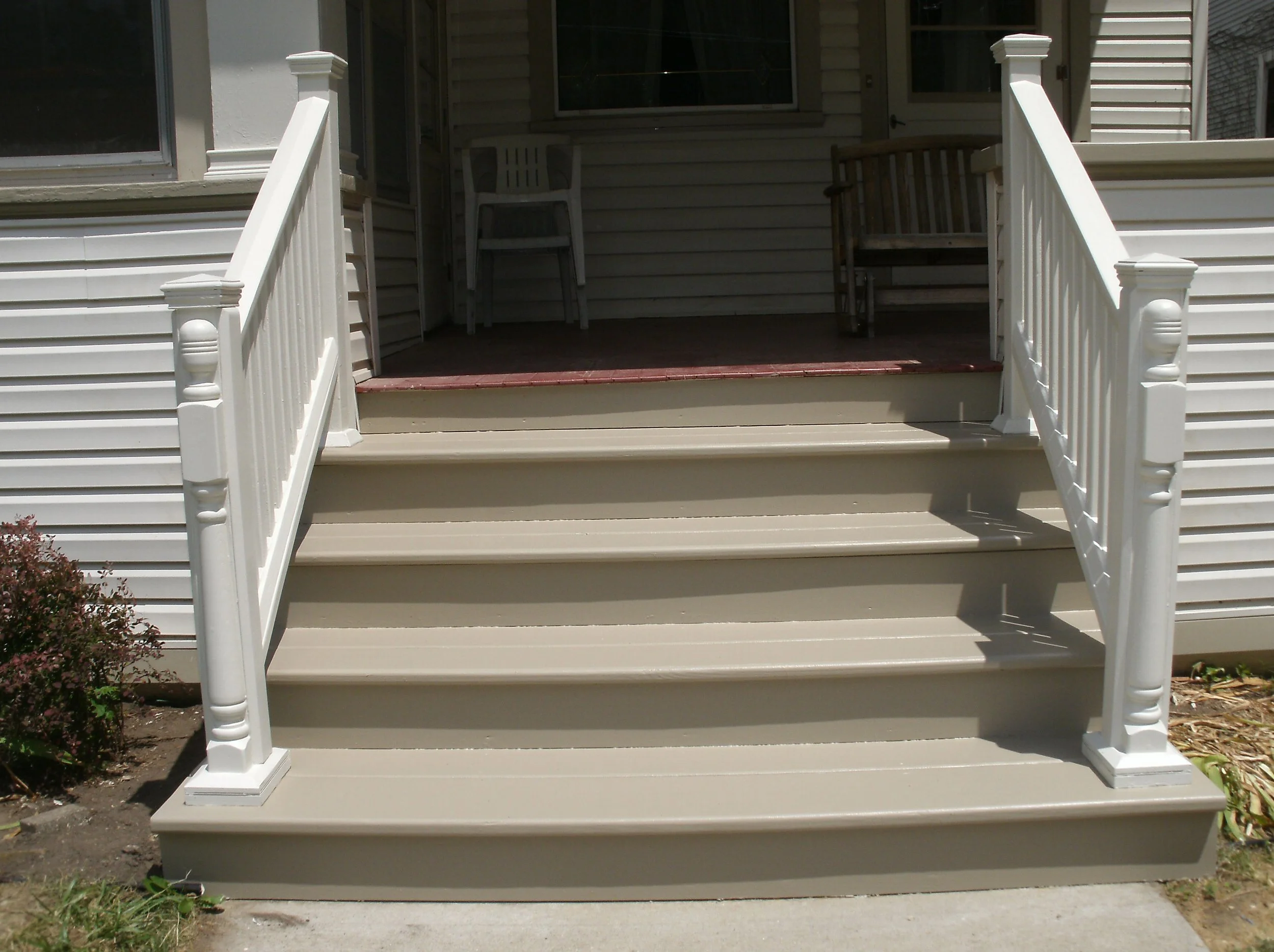 Fully painted front stairs. Note decorative half post attached to newell posts.