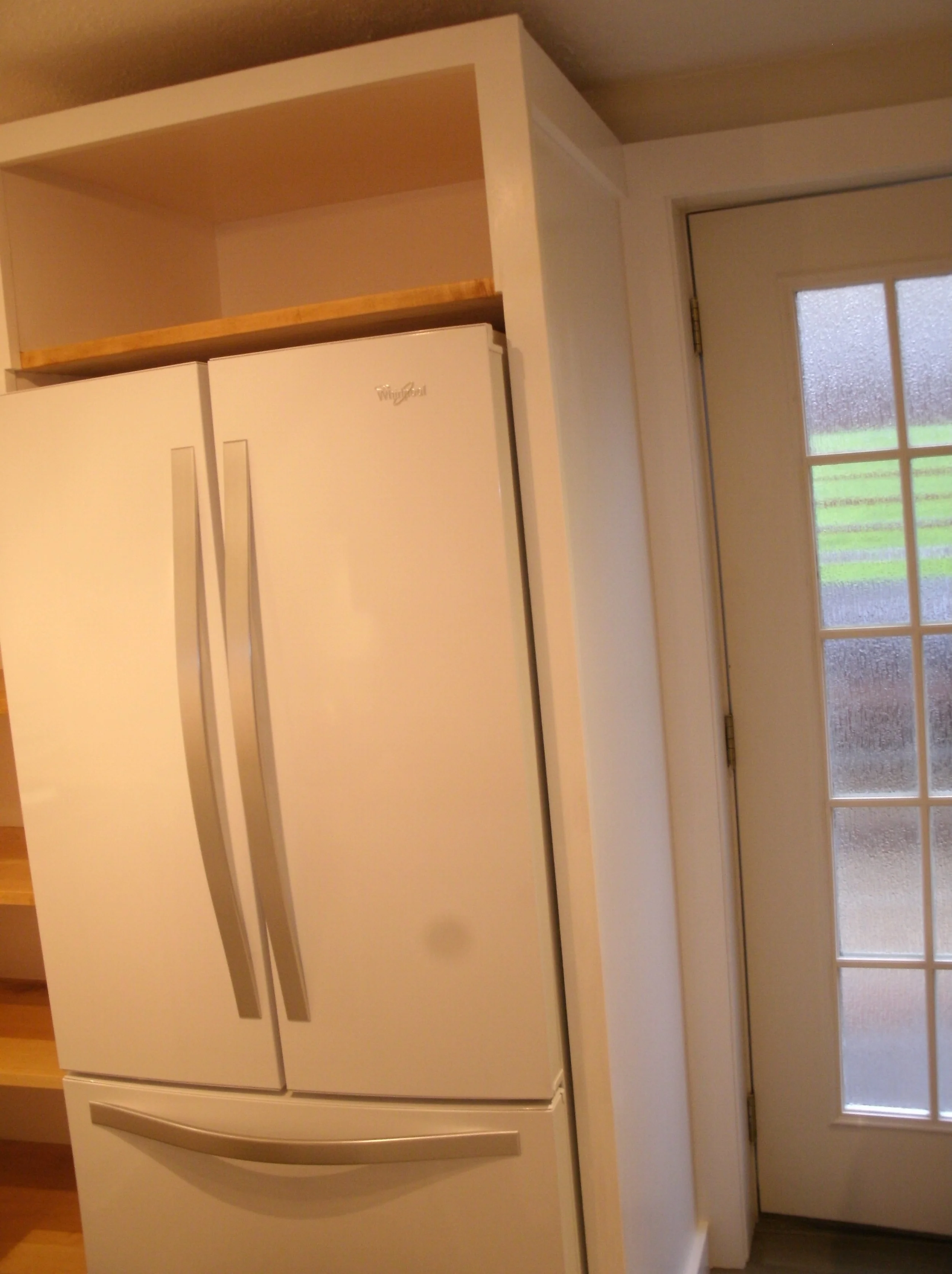 Refrigerator enclosure box with shelf above