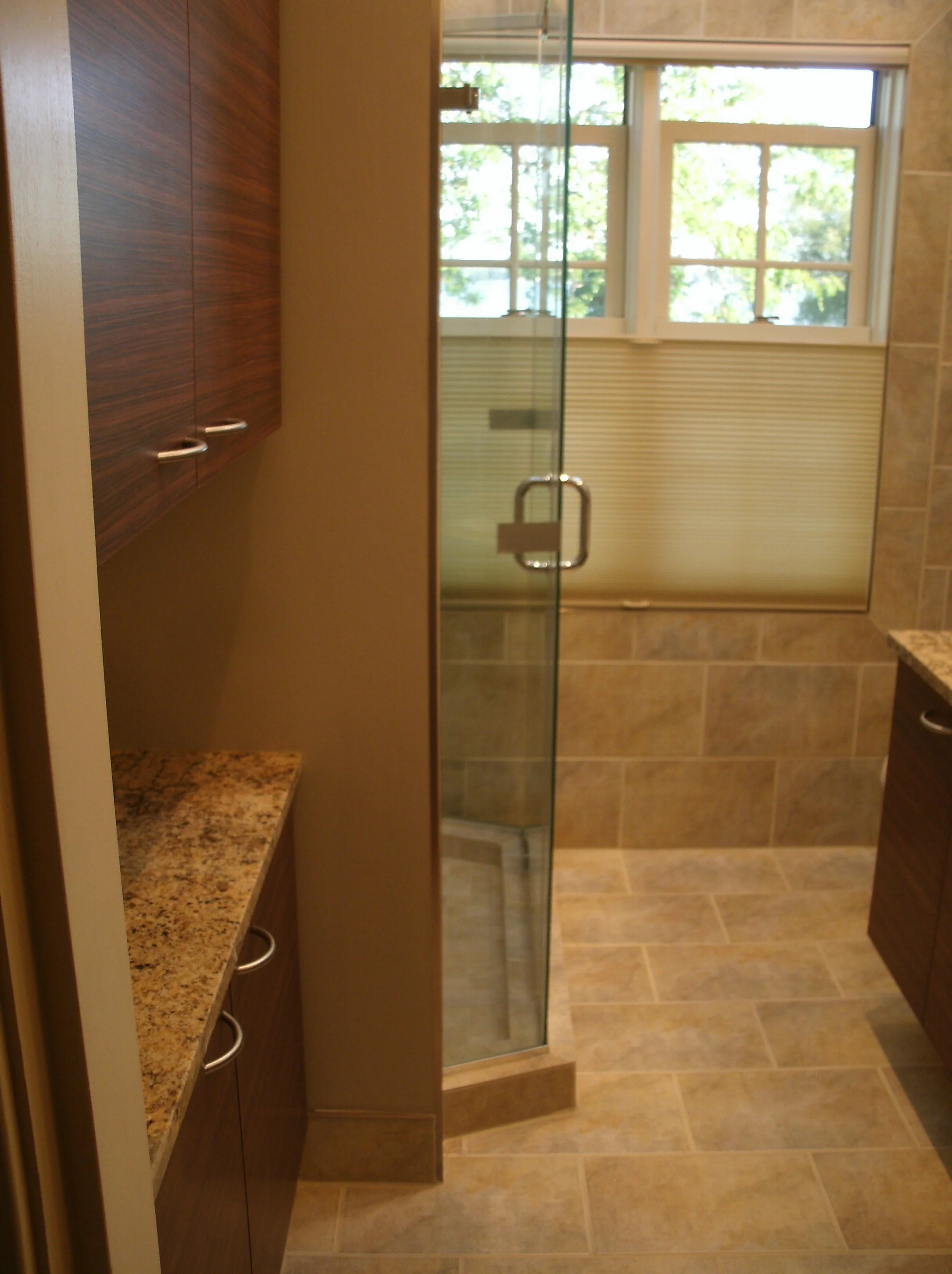 View of the room with glass shower door installed