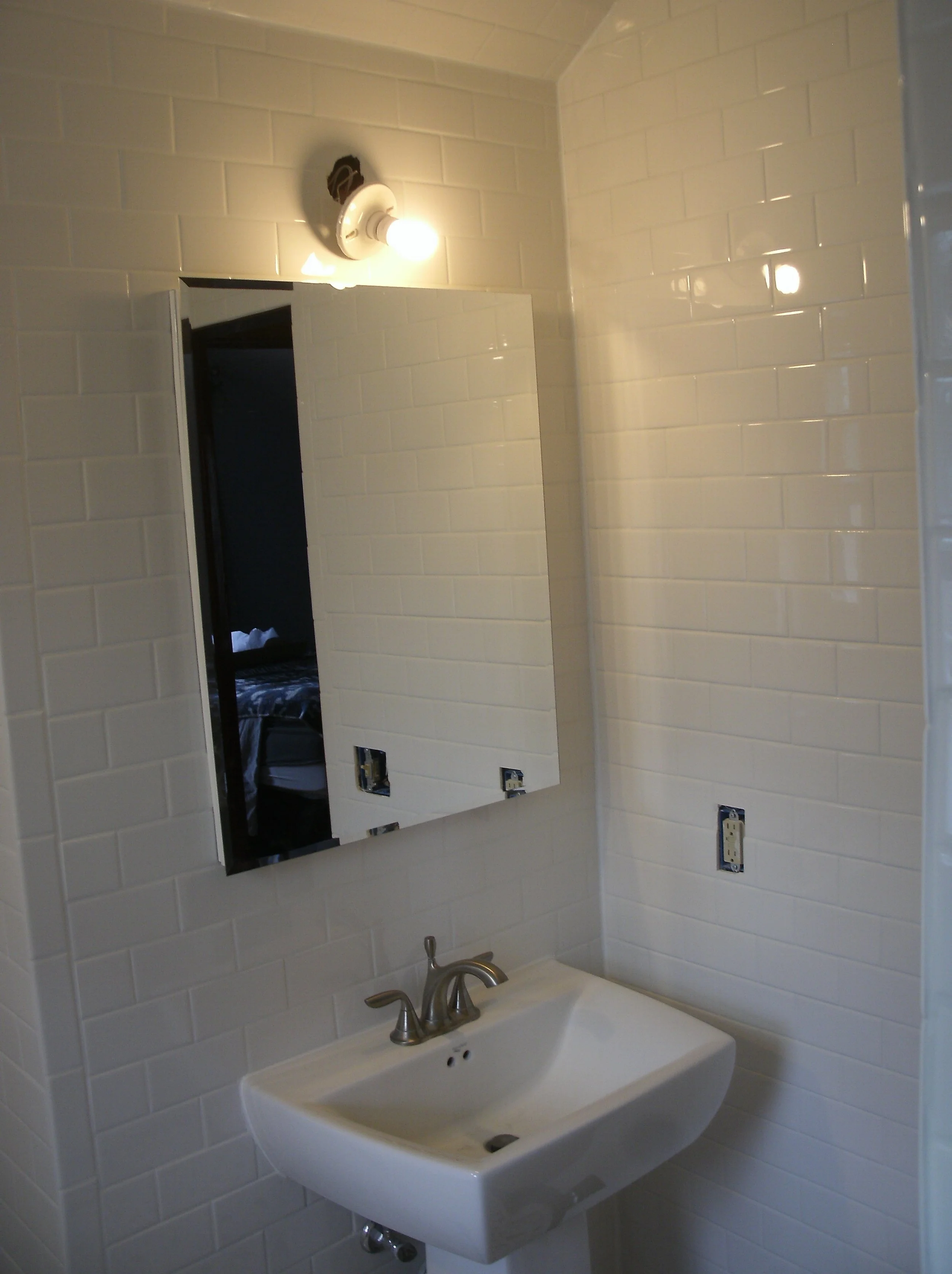 View of sink and medicine cabinet. I tiled all the walls.