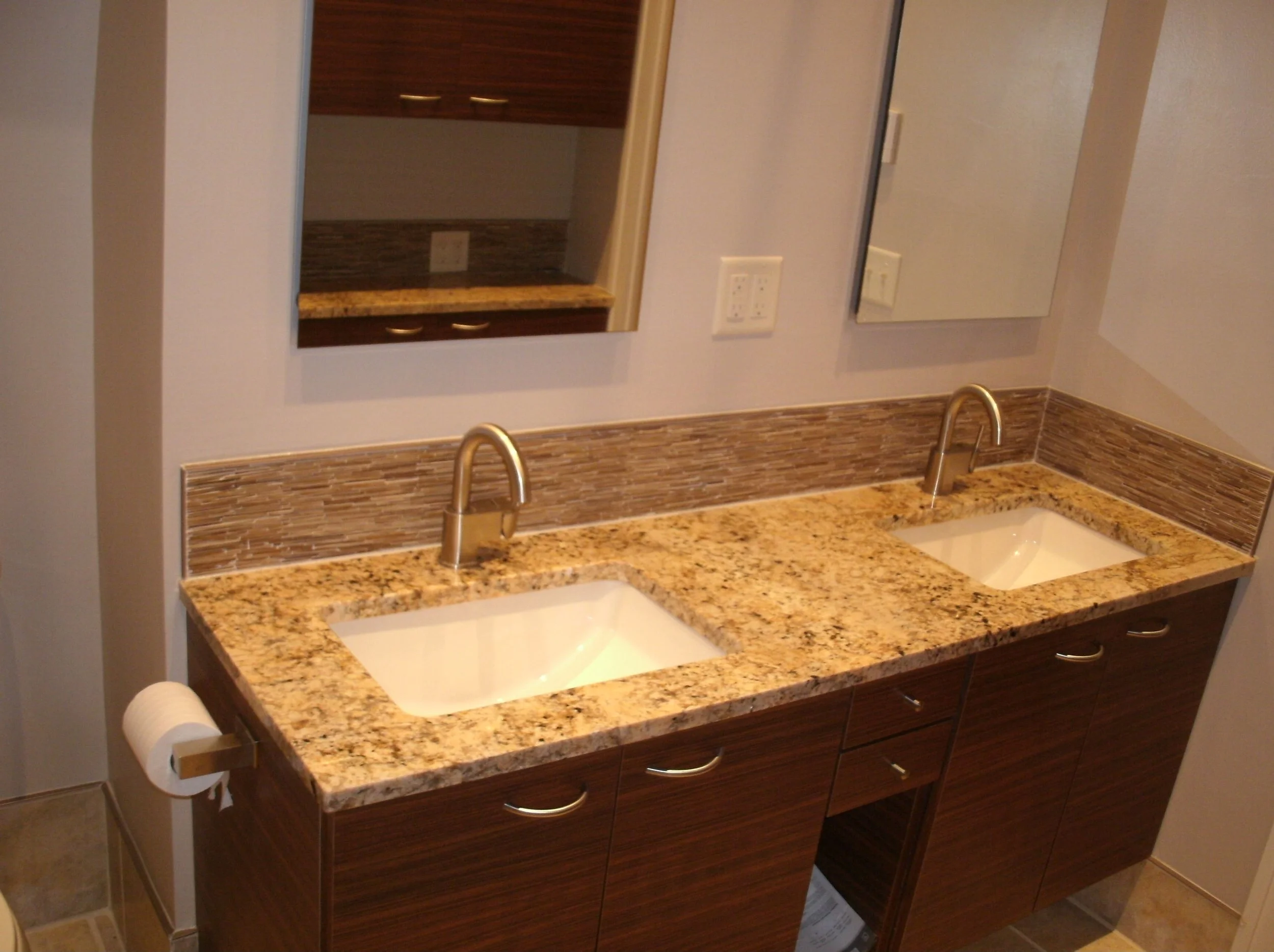 Another view of the twin sinks and twin medicine cabinets