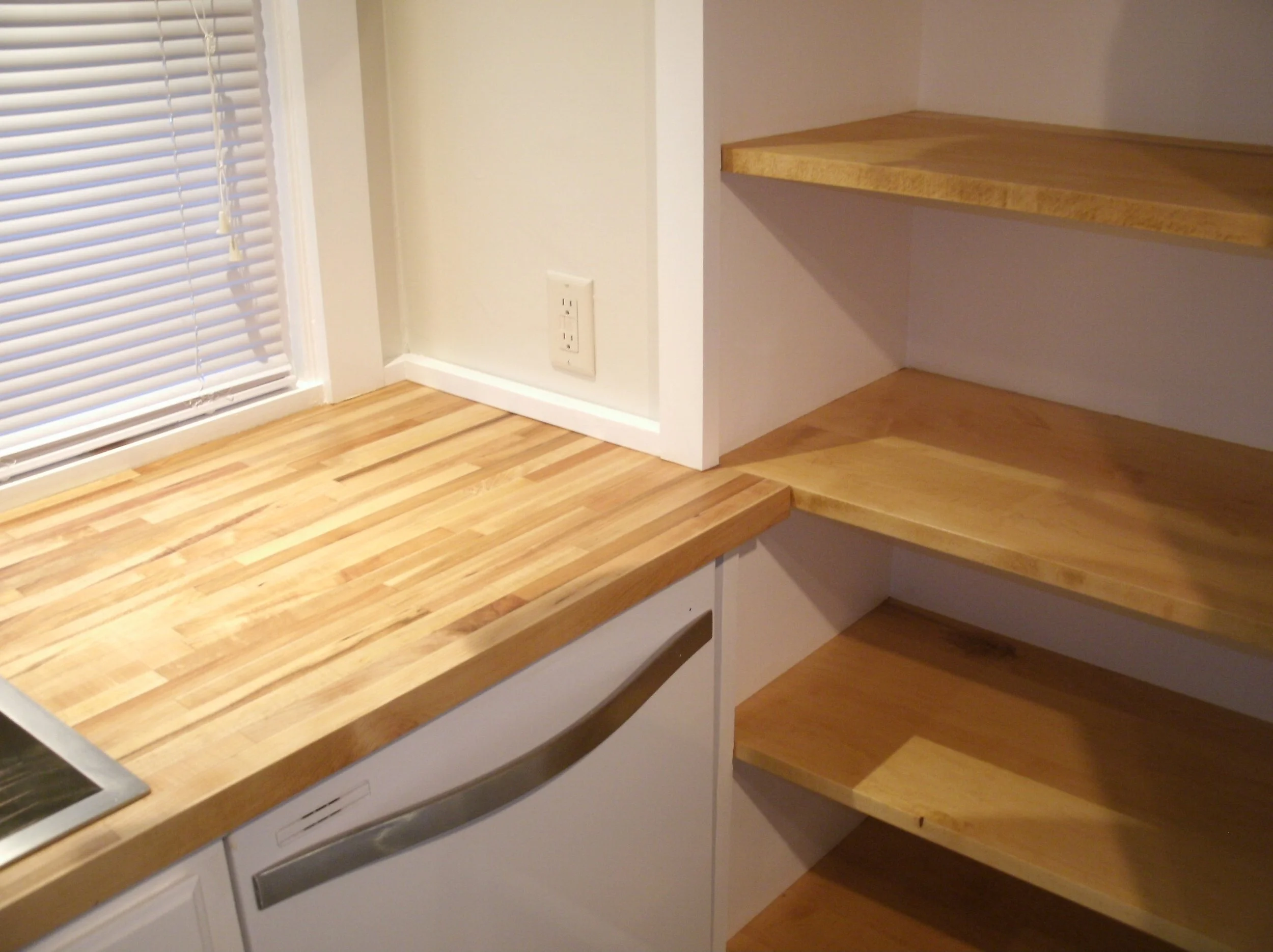 Right Side of sink countertop with adjacent shelves