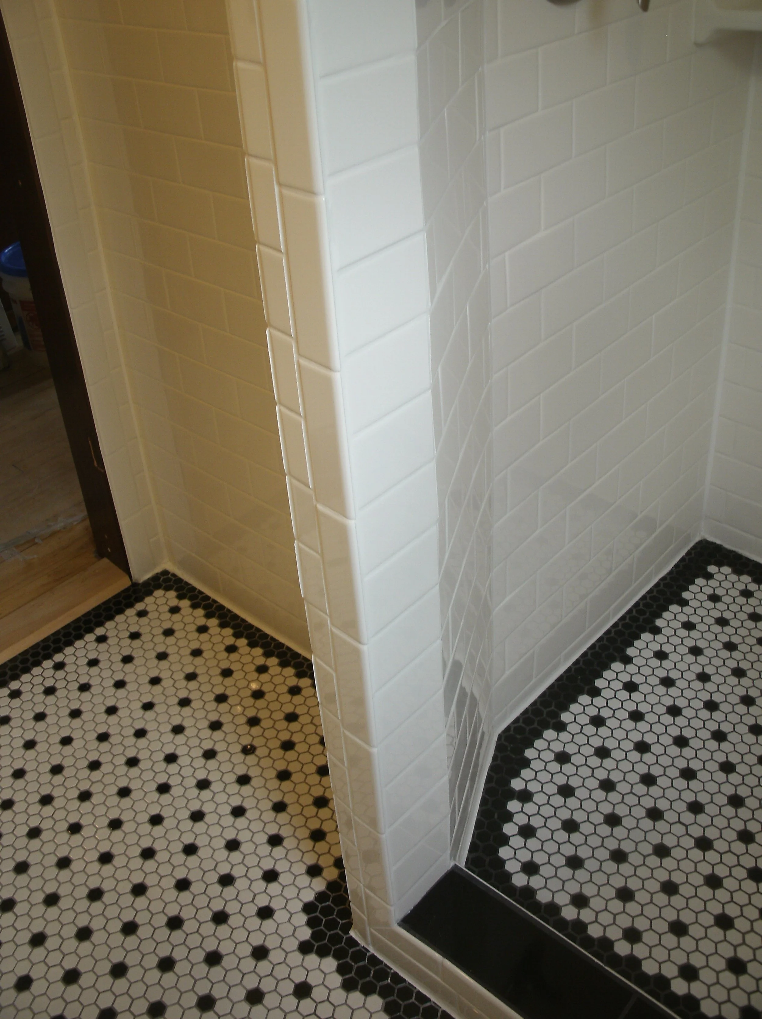 Another view of the shower wall and floor