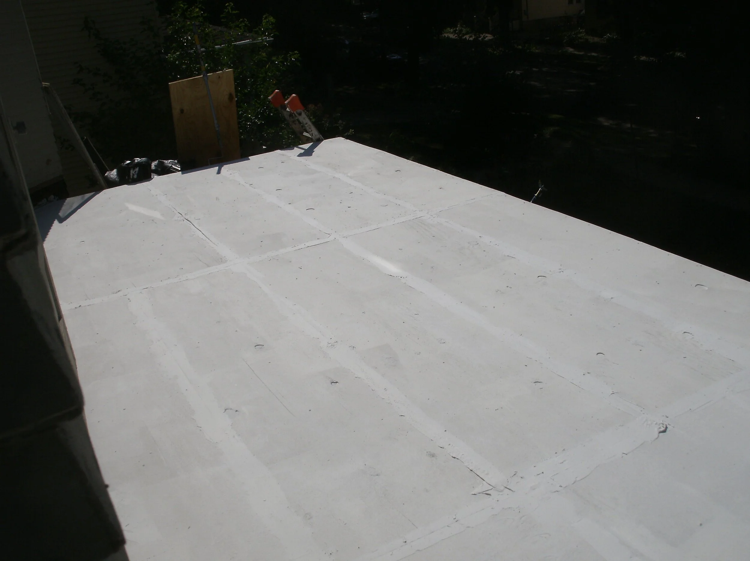 Plywood roof sheathing installed. Seams caulked, 3 coats of roofing sealer applied.