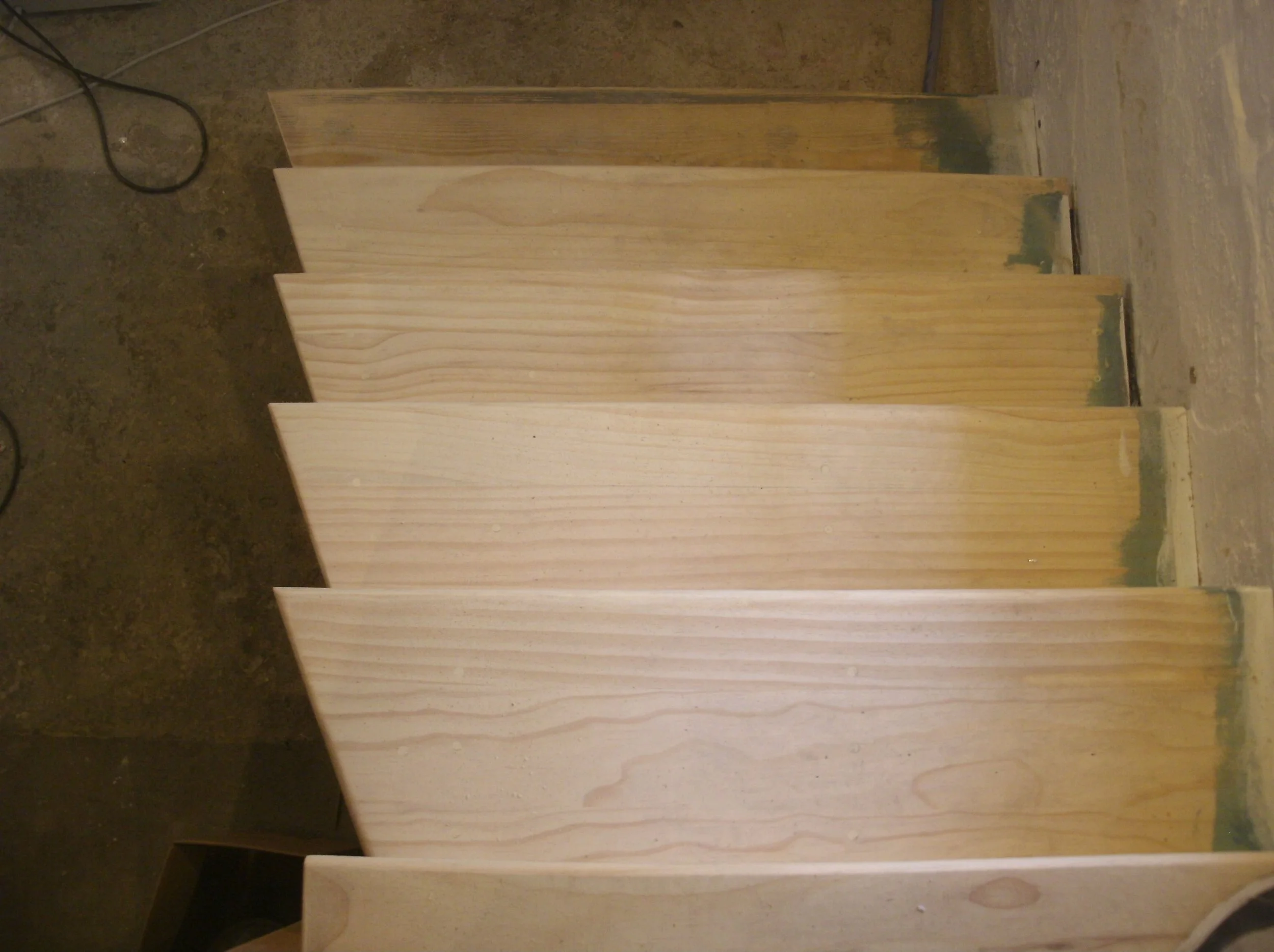 A good view of the treads widened to welcome basement goers