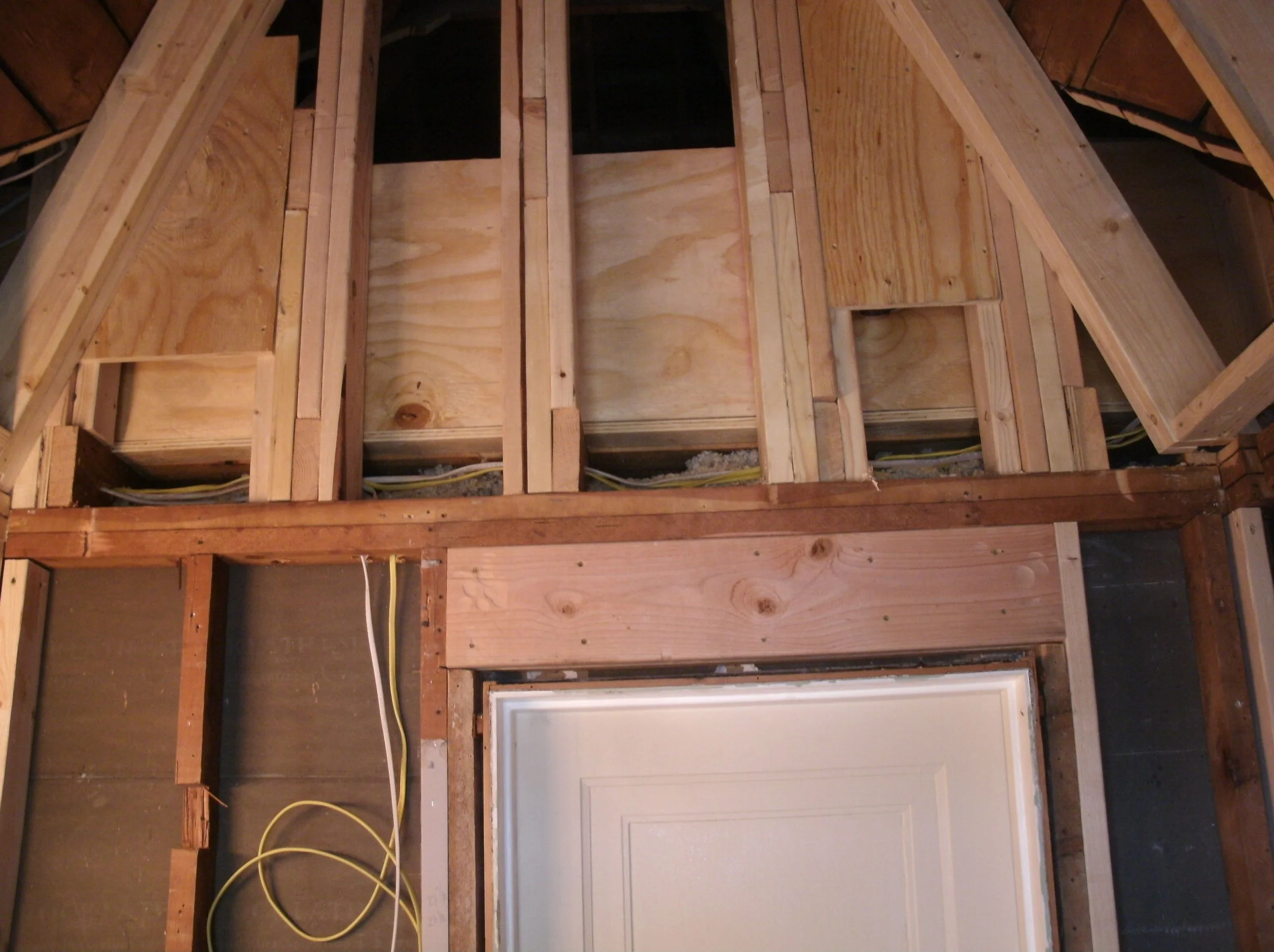 Ceiling out and studding begun. Separating new A-frame ceiling from attic.